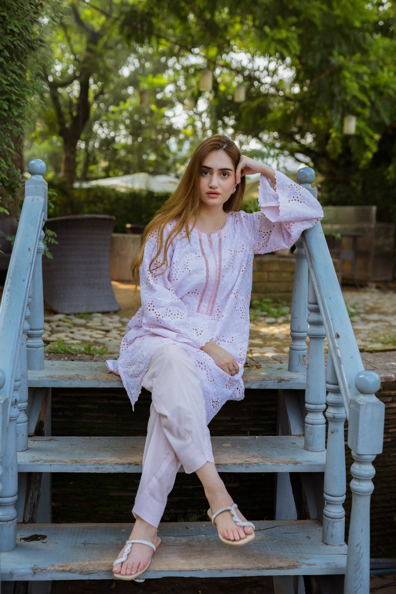 Elegant powder pink kurta featuring detailed Shifli Chikan cutwork and lace accents, complemented by a straight Khari Shalwar.