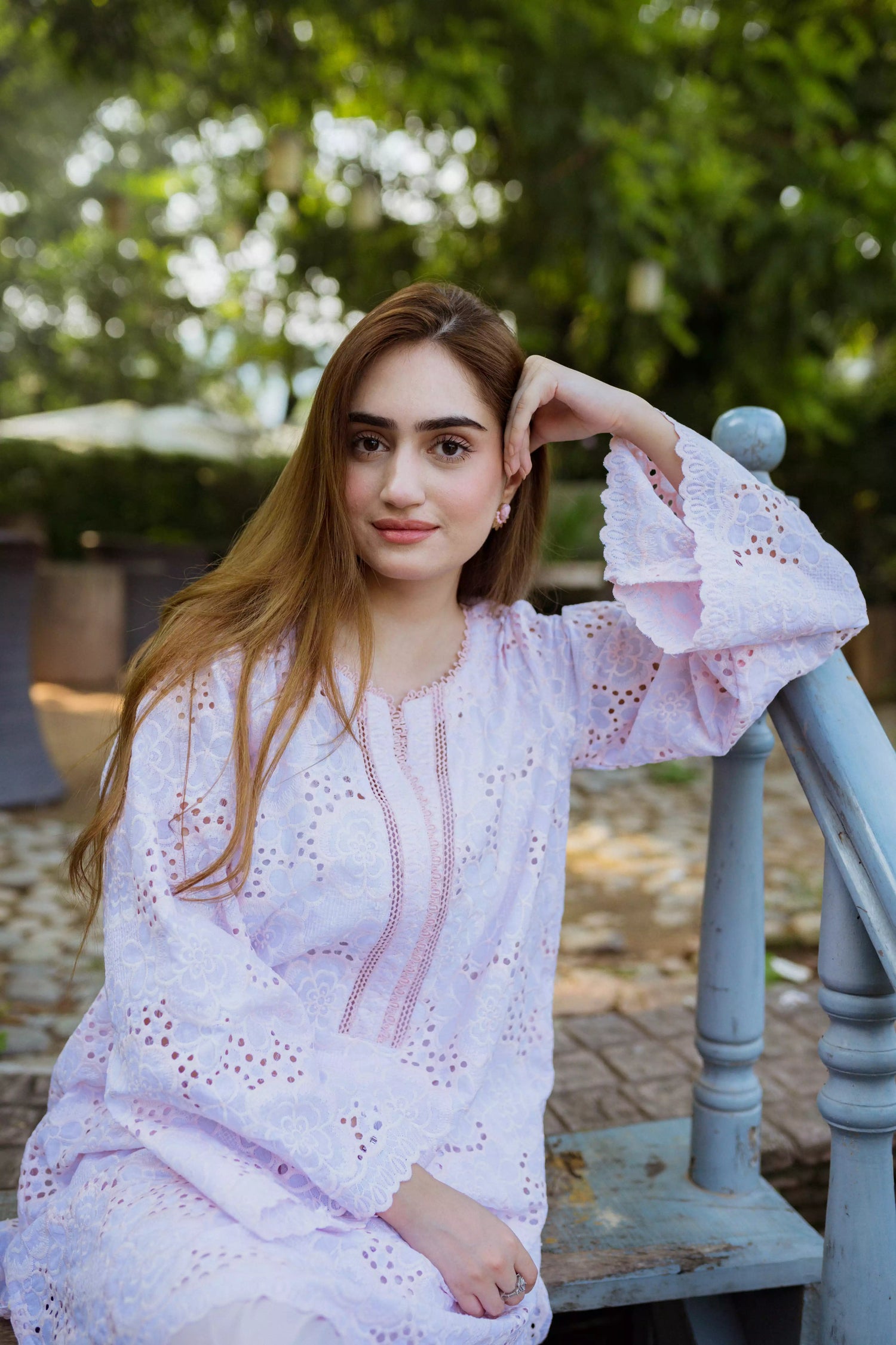 Elegant powder pink kurta featuring detailed Shifli Chikan cutwork and lace accents, complemented by a straight Khari Shalwar.