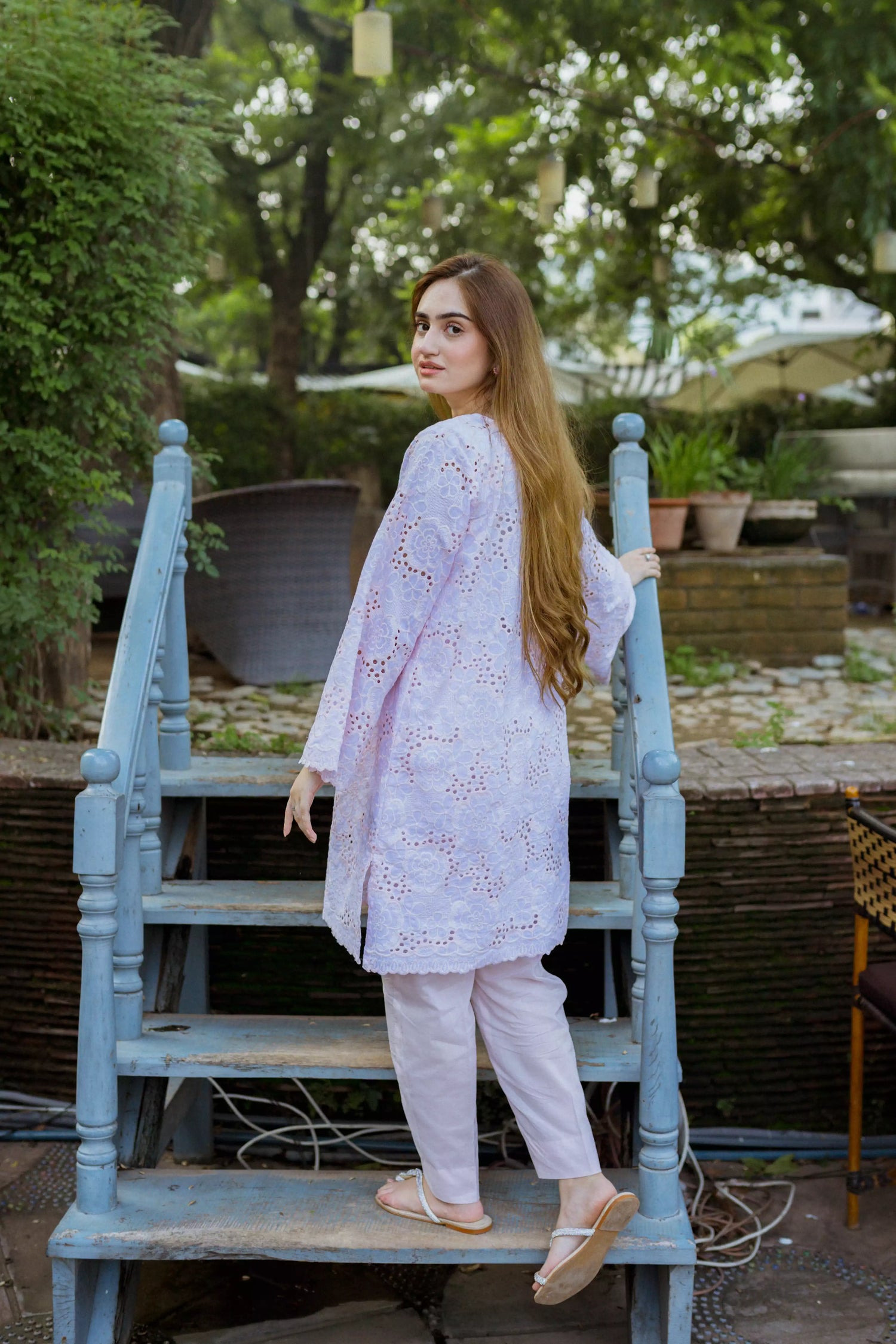 Elegant powder pink kurta featuring detailed Shifli Chikan cutwork and lace accents, complemented by a straight Khari Shalwar.