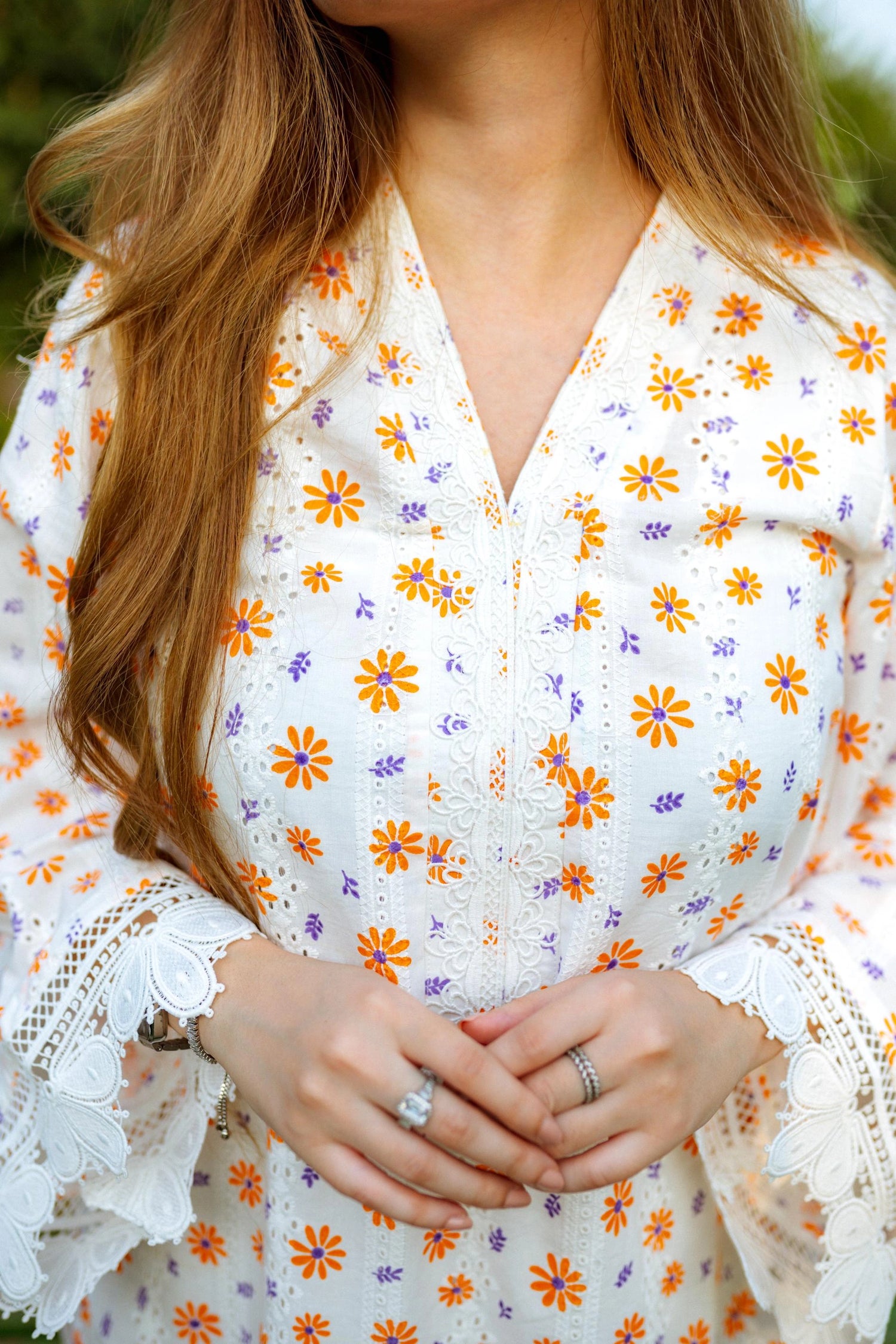 Floral White Chikan Kurta featuring a delicate floral pattern, lace neckline, and sleeve accents for a timeless and elegant look.