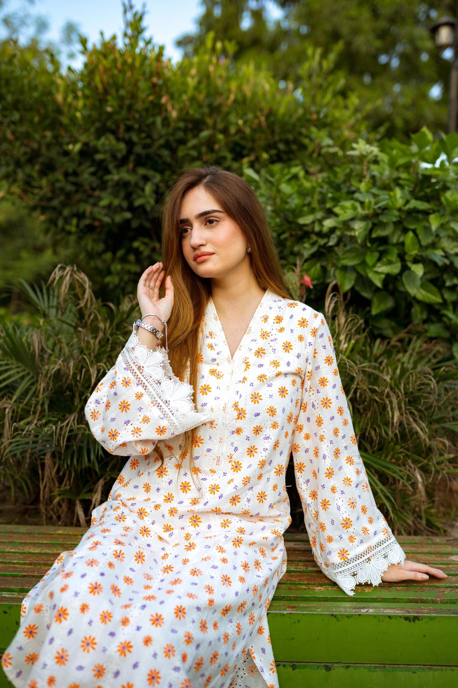 Floral White Chikan Kurta featuring a delicate floral pattern, lace neckline, and sleeve accents for a timeless and elegant look.