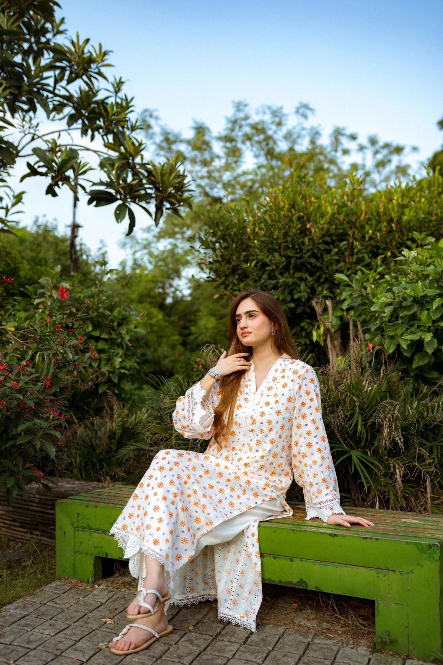 Floral White Chikan Kurta featuring a delicate floral pattern, lace neckline, and sleeve accents for a timeless and elegant look.