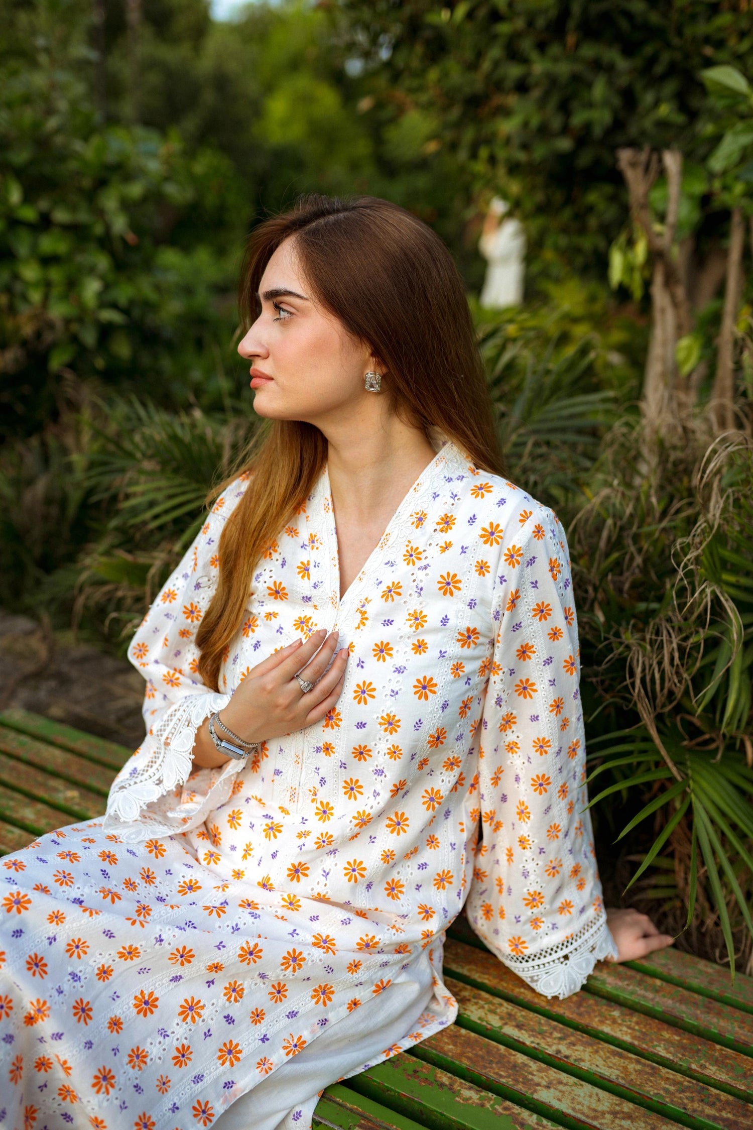 Floral White Chikan Kurta featuring a delicate floral pattern, lace neckline, and sleeve accents for a timeless and elegant look.