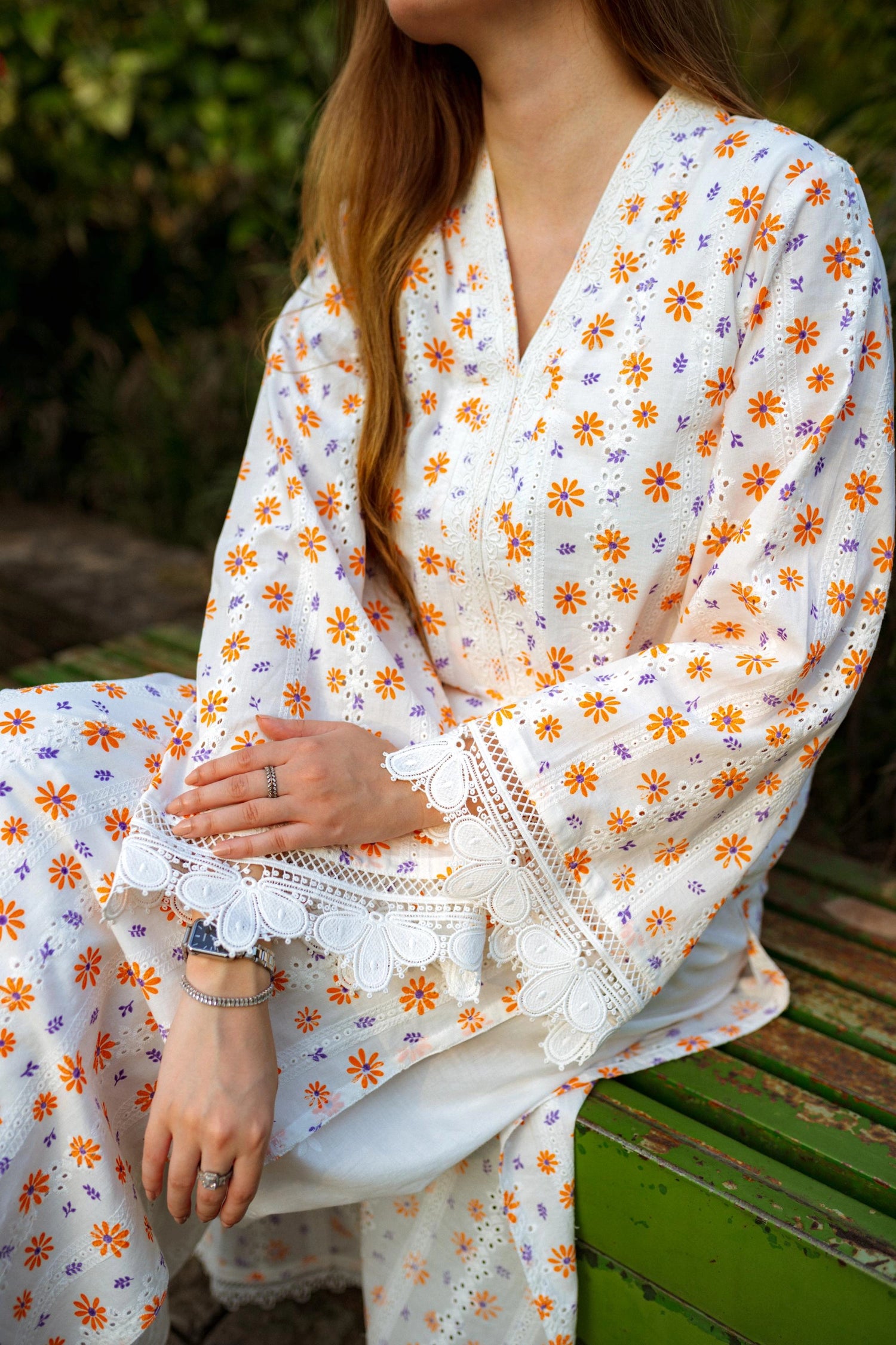 Floral White Chikan Kurta featuring a delicate floral pattern, lace neckline, and sleeve accents for a timeless and elegant look.