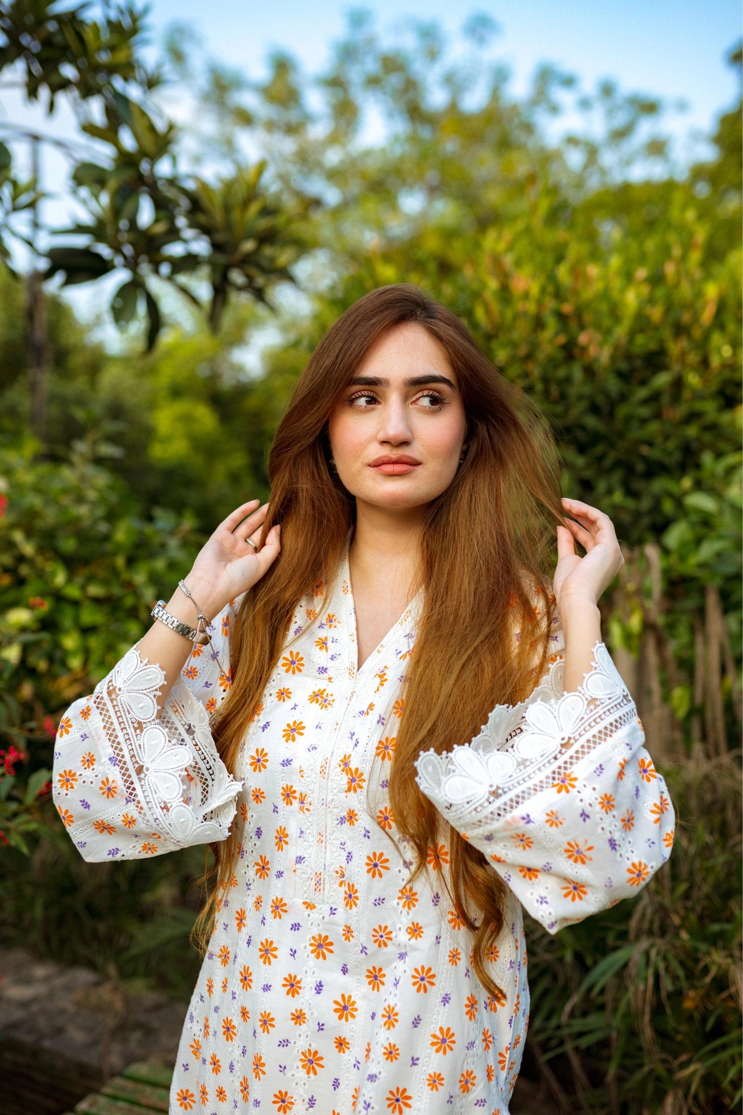 Floral White Chikan Kurta featuring a delicate floral pattern, lace neckline, and sleeve accents for a timeless and elegant look.
