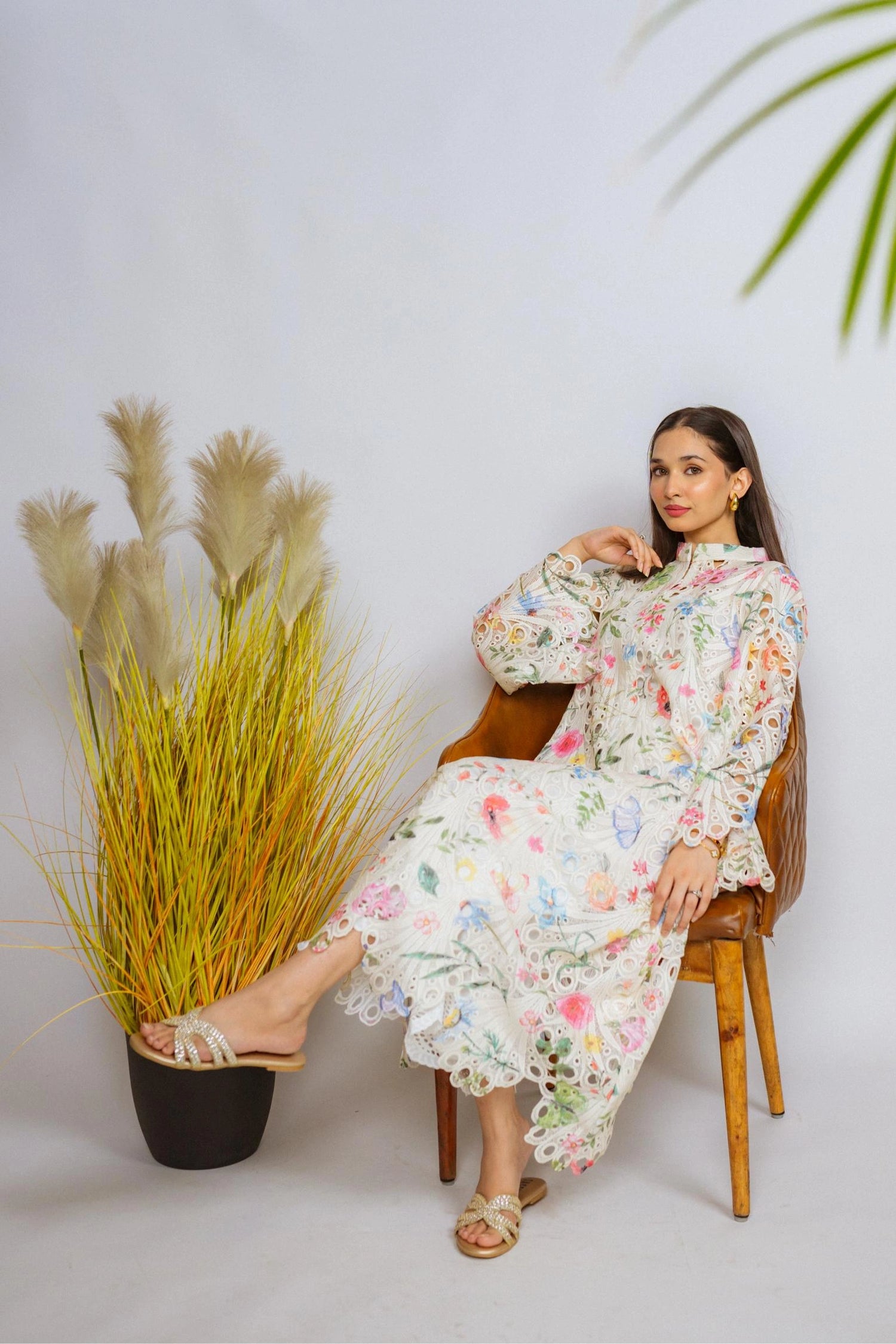 Multi-floral cutwork kaftan-style shirt with flared sleeves, featuring a vibrant design and relaxed, flowy fit for comfort.