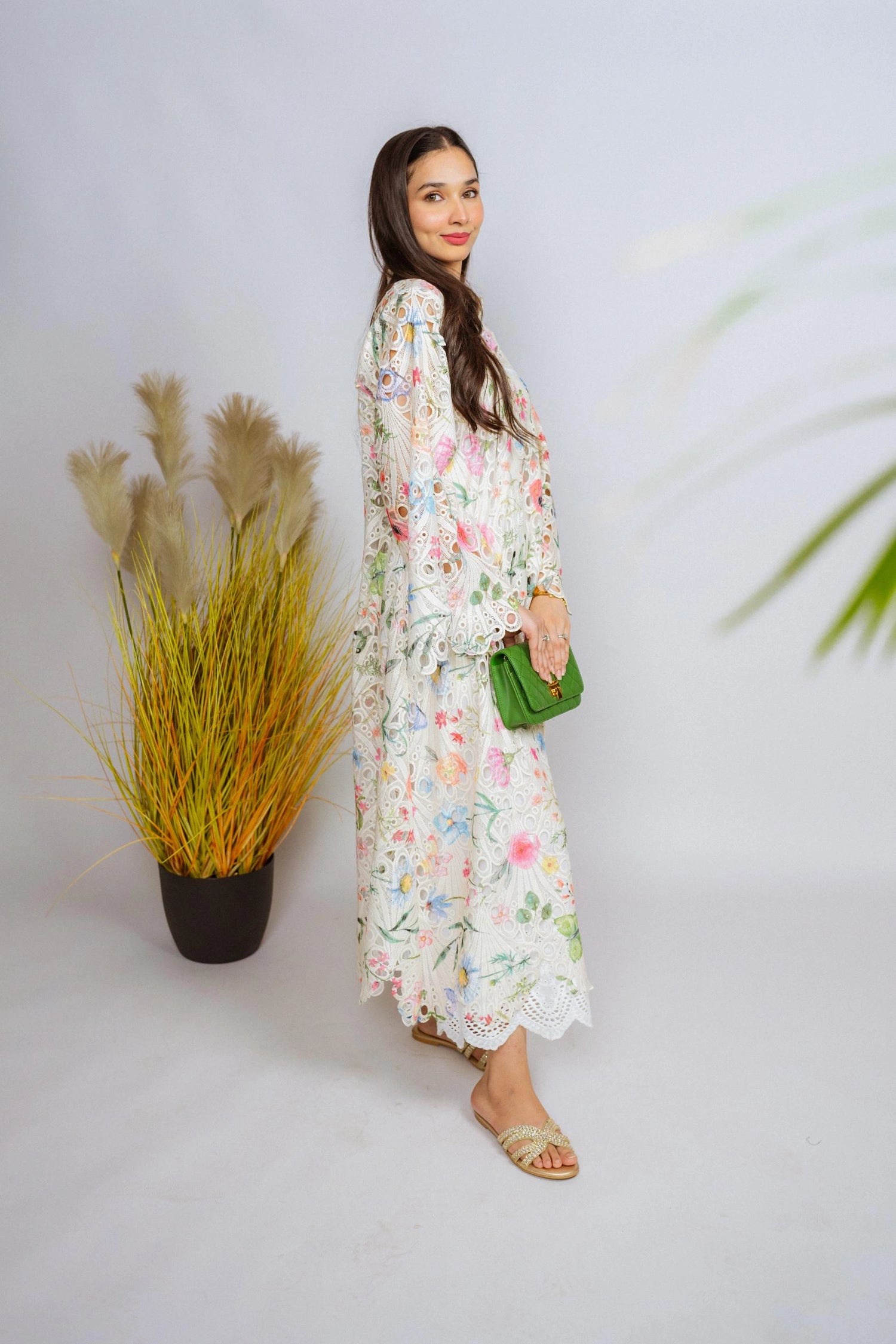 Multi-floral cutwork kaftan-style shirt with flared sleeves, featuring a vibrant design and relaxed, flowy fit for comfort.