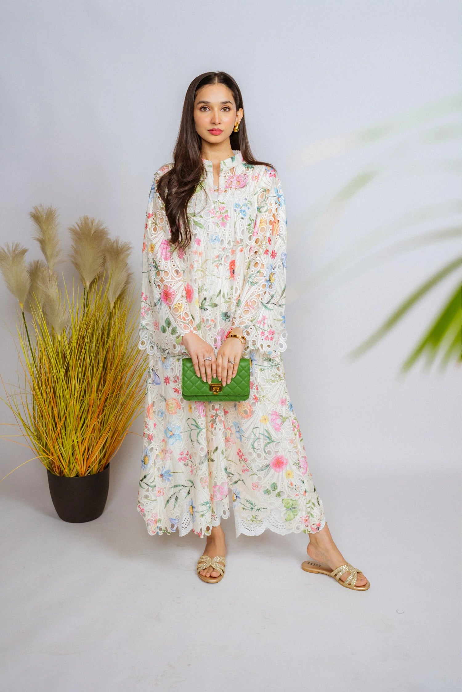 Multi-floral cutwork kaftan-style shirt with flared sleeves, featuring a vibrant design and relaxed, flowy fit for comfort.