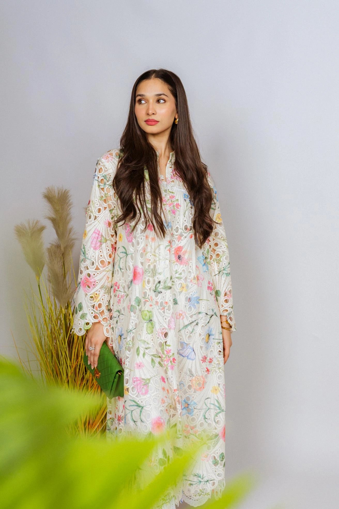 Multi-floral cutwork kaftan-style shirt with flared sleeves, featuring a vibrant design and relaxed, flowy fit for comfort.
