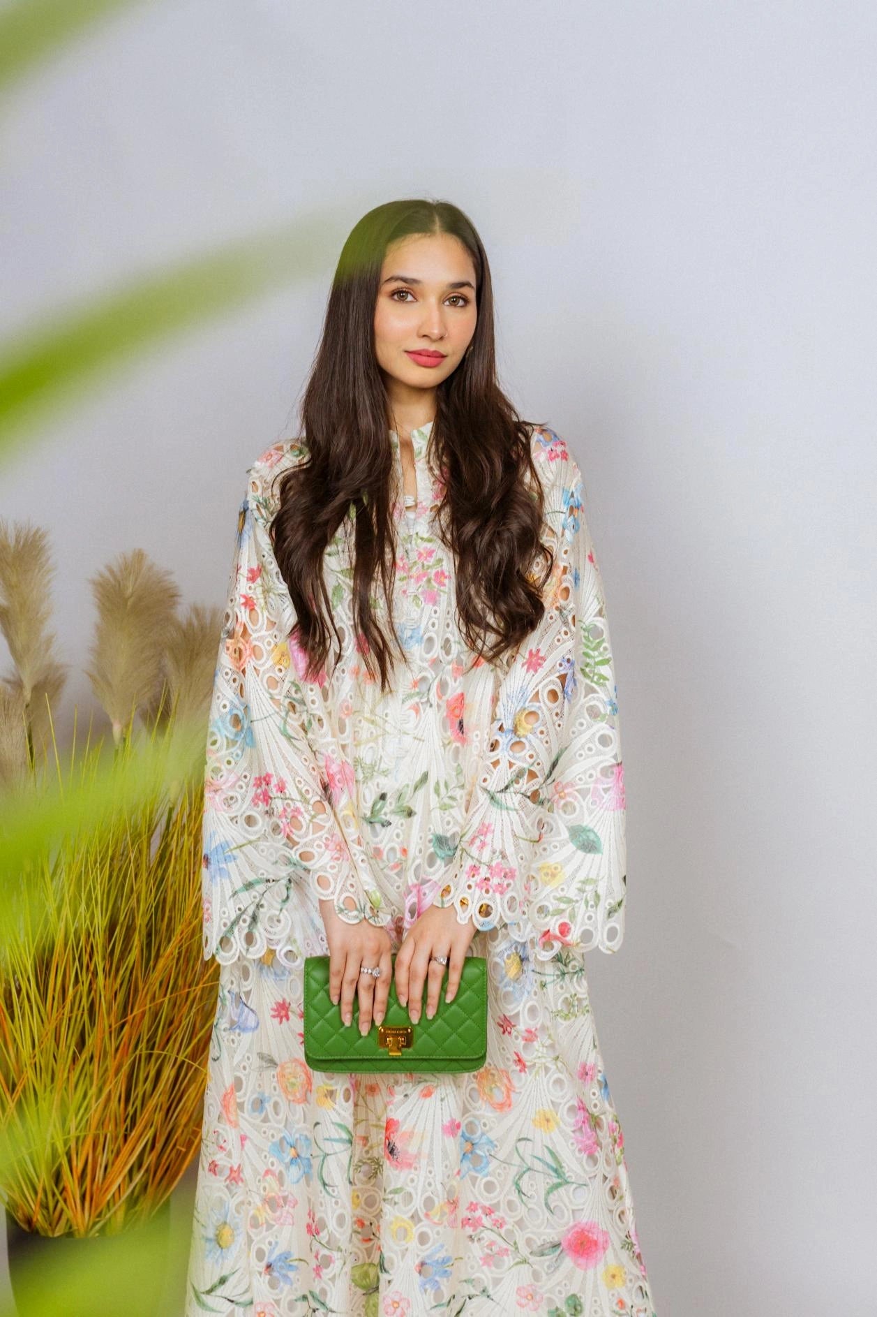Multi-floral cutwork kaftan-style shirt with flared sleeves, featuring a vibrant design and relaxed, flowy fit for comfort.
