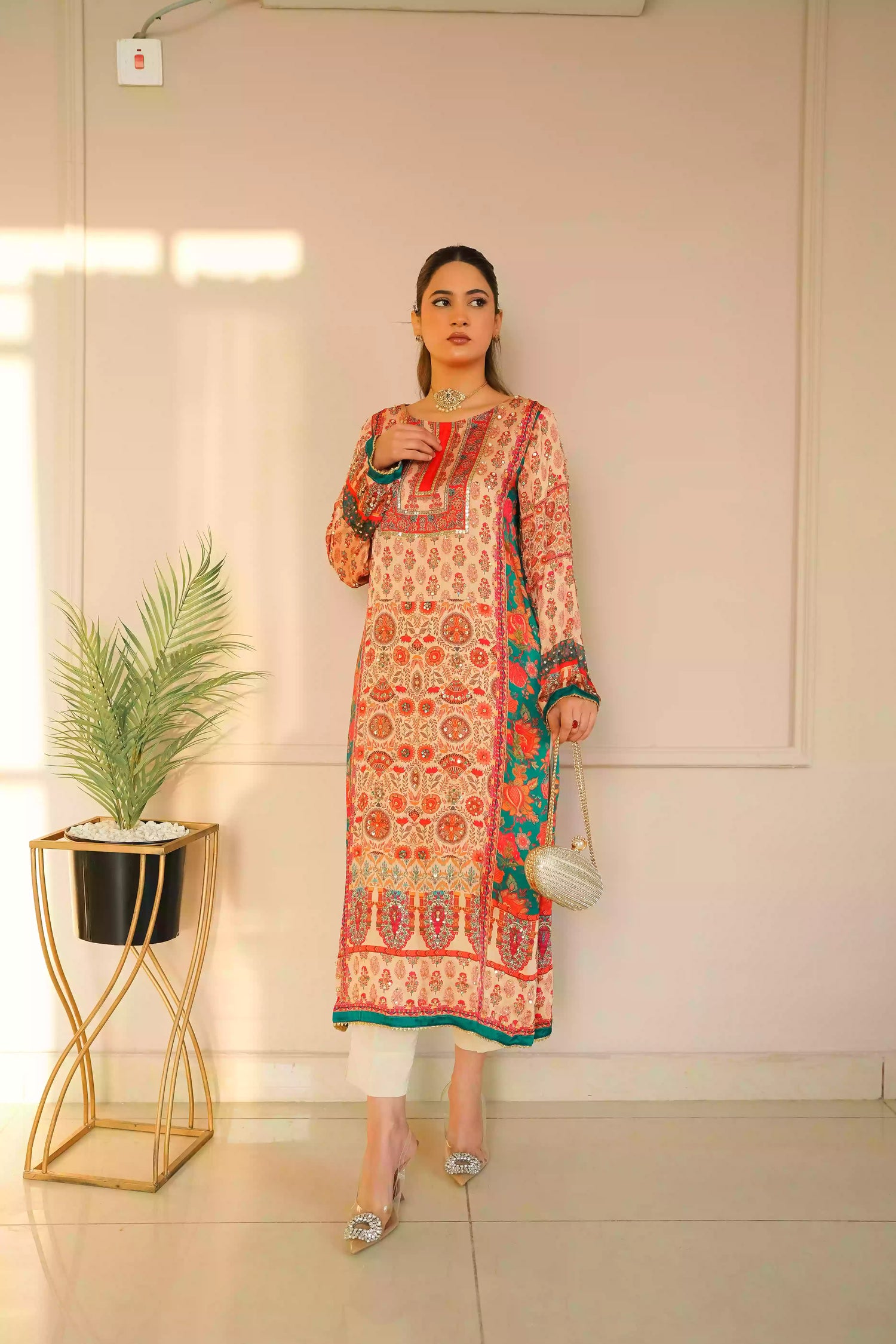 Discover festive kurta crafted from premium silk with warm floral prints and delicate hand-finished embellishments, featuring a smooth, lightweight drape that blends traditional elegance with contemporary style for special occasions.