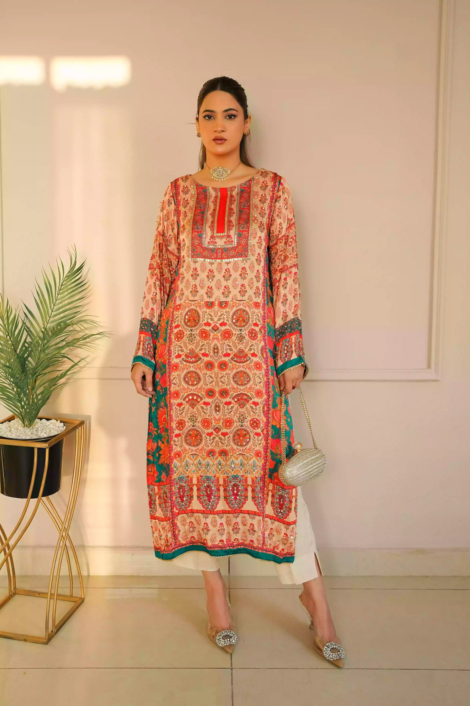 Discover festive kurta crafted from premium silk with warm floral prints and delicate hand-finished embellishments, featuring a smooth, lightweight drape that blends traditional elegance with contemporary style for special occasions.