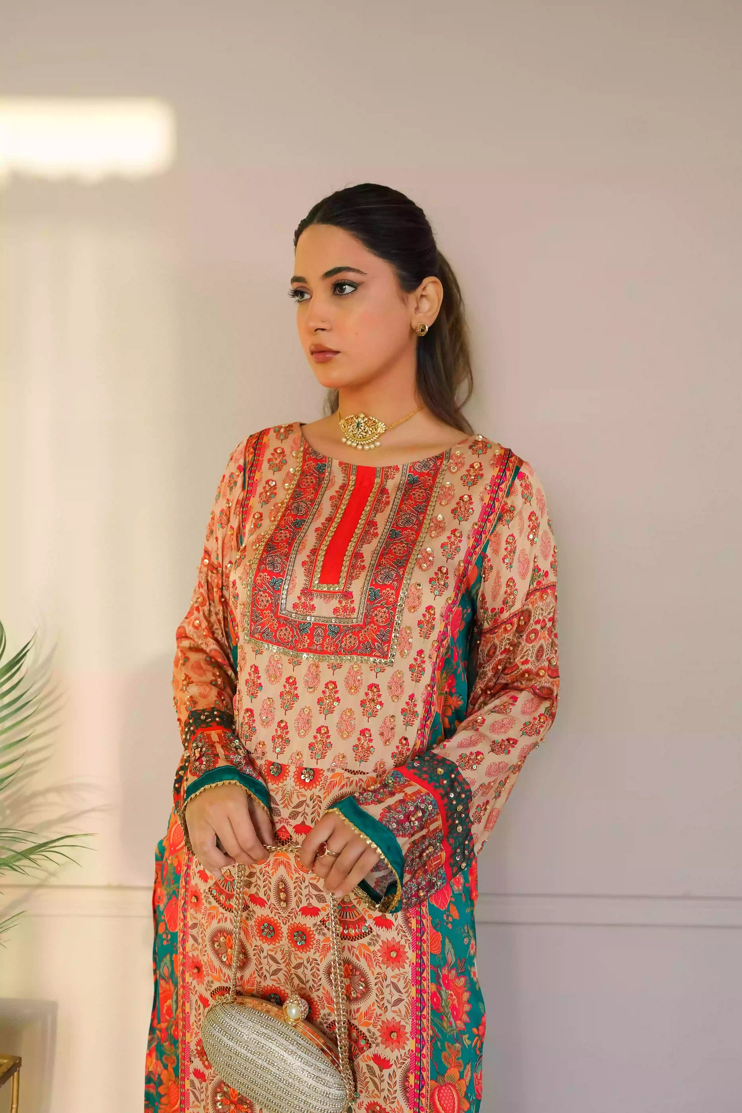 Discover festive kurta crafted from premium silk with warm floral prints and delicate hand-finished embellishments, featuring a smooth, lightweight drape that blends traditional elegance with contemporary style for special occasions.