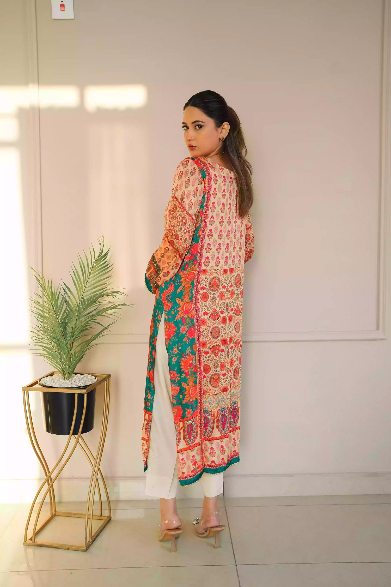 Discover festive kurta crafted from premium silk with warm floral prints and delicate hand-finished embellishments, featuring a smooth, lightweight drape that blends traditional elegance with contemporary style for special occasions.
