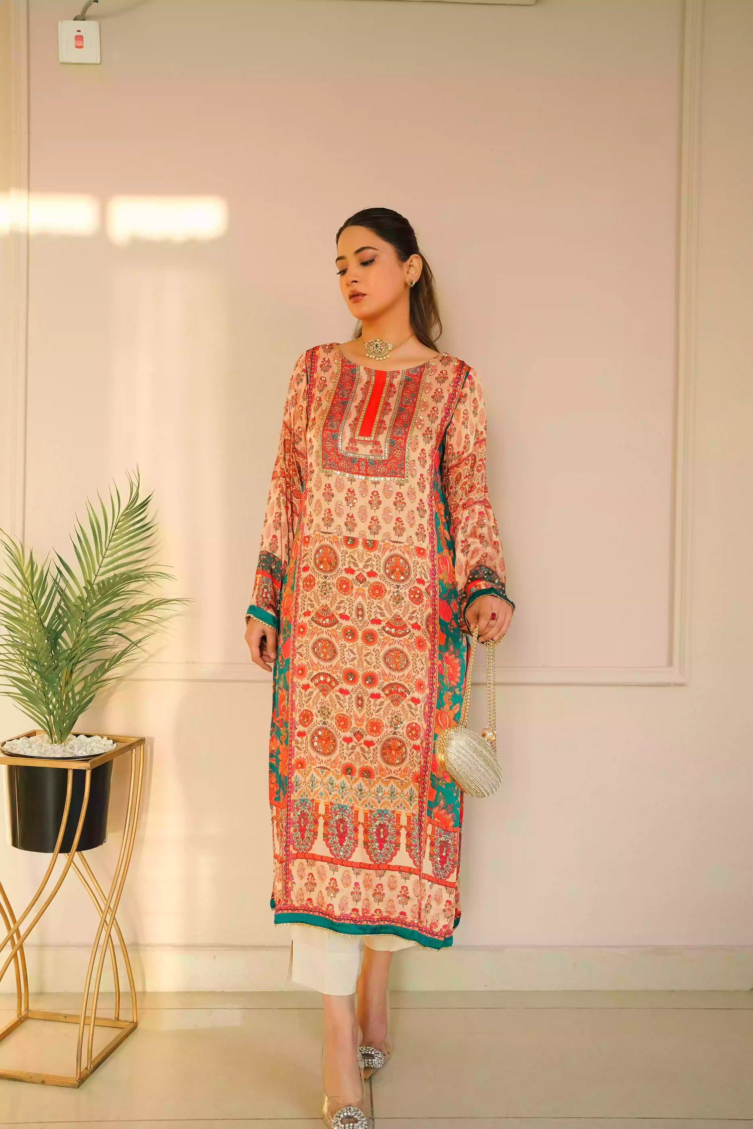 Discover festive kurta crafted from premium silk with warm floral prints and delicate hand-finished embellishments, featuring a smooth, lightweight drape that blends traditional elegance with contemporary style for special occasions.