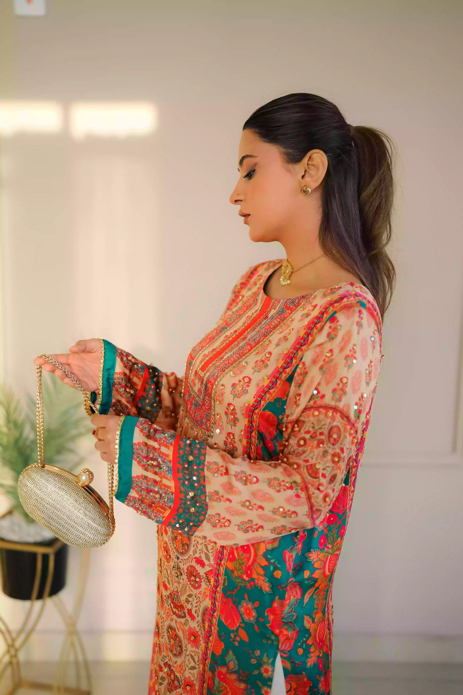 Discover festive kurta crafted from premium silk with warm floral prints and delicate hand-finished embellishments, featuring a smooth, lightweight drape that blends traditional elegance with contemporary style for special occasions.