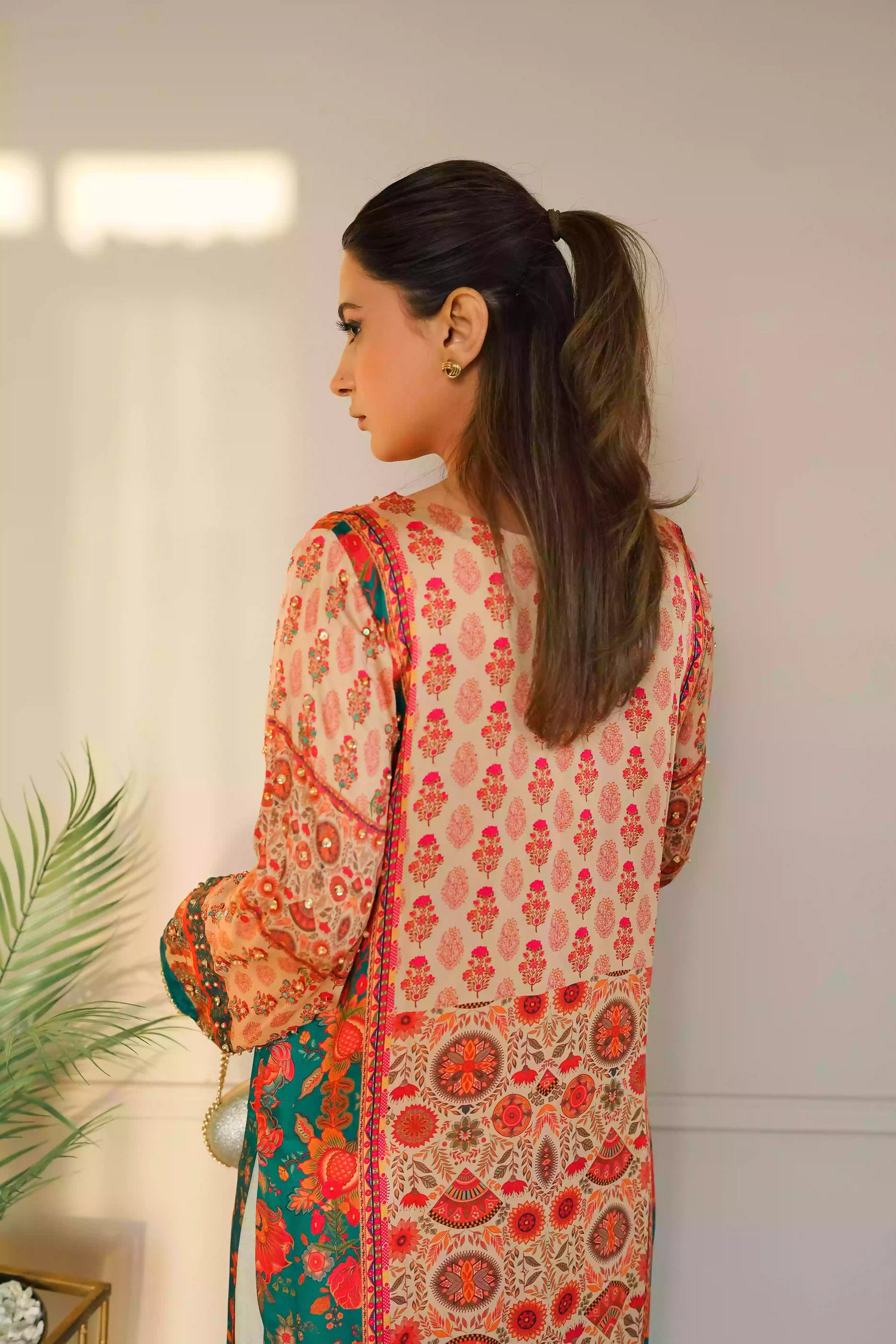 Discover festive kurta crafted from premium silk with warm floral prints and delicate hand-finished embellishments, featuring a smooth, lightweight drape that blends traditional elegance with contemporary style for special occasions.