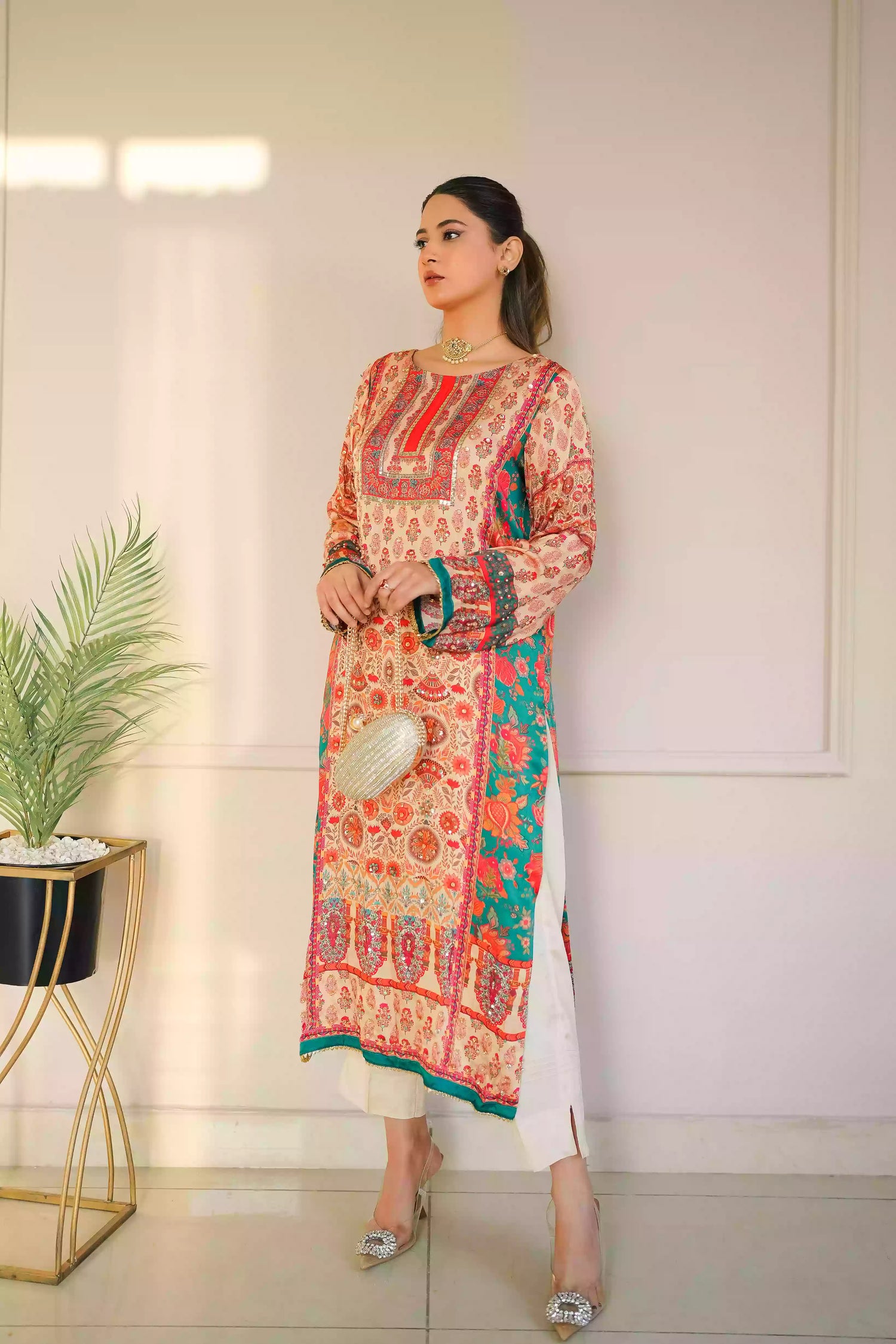 Discover festive kurta crafted from premium silk with warm floral prints and delicate hand-finished embellishments, featuring a smooth, lightweight drape that blends traditional elegance with contemporary style for special occasions.
