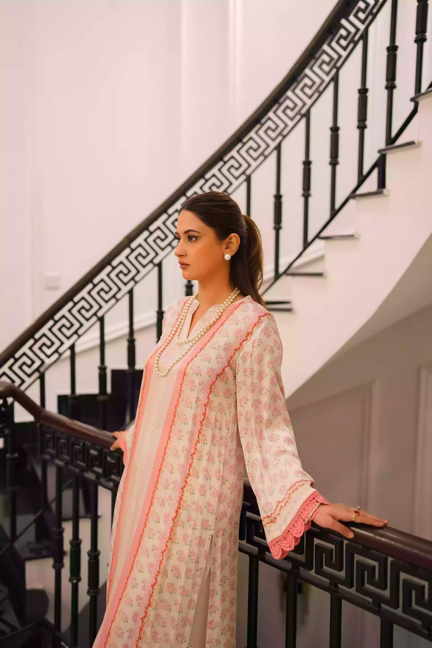 White and blush-pink silk kurta with delicate floral motifs and subtle hand-finished embellishments, featuring a lightweight, flowing drape that creates an elegant silhouette, ideal for Eid and festive daytime celebrations.
