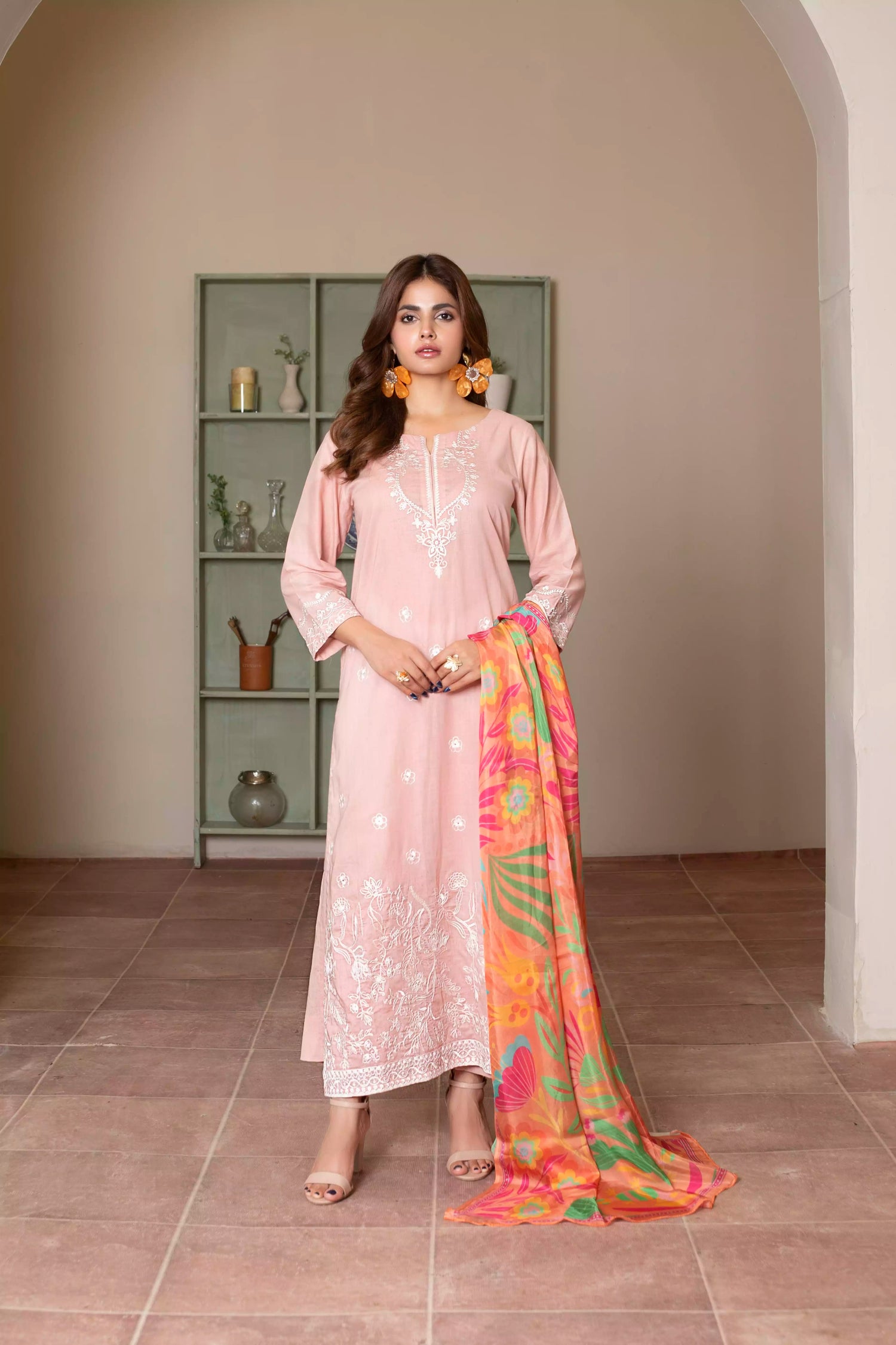 Soft pink embroidered suit with white floral motifs, matching trousers, and a vibrant multicolor silk dupatta for summer elegance.