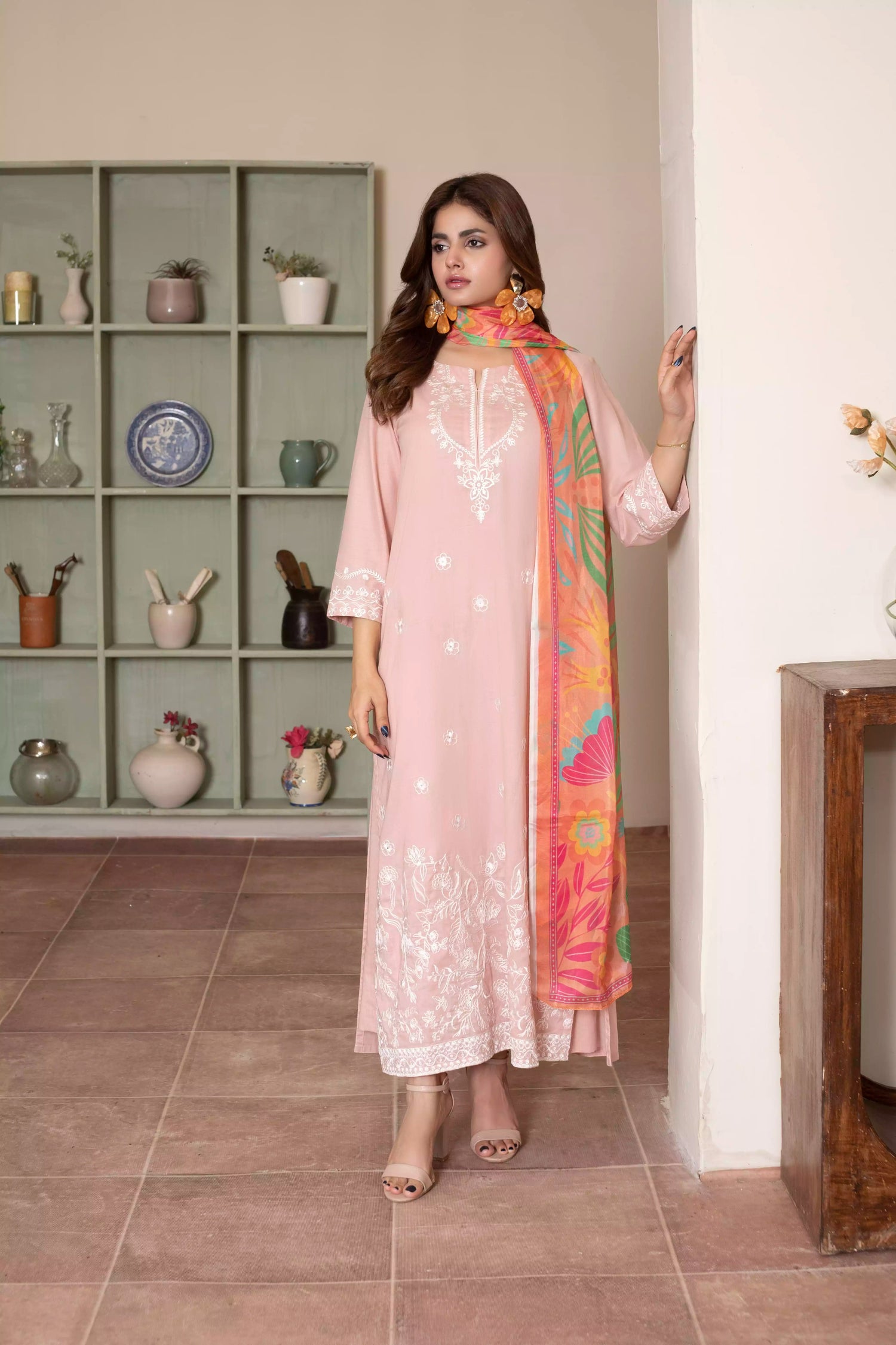 Soft pink embroidered suit with white floral motifs, matching trousers, and a vibrant multicolor silk dupatta for summer elegance.