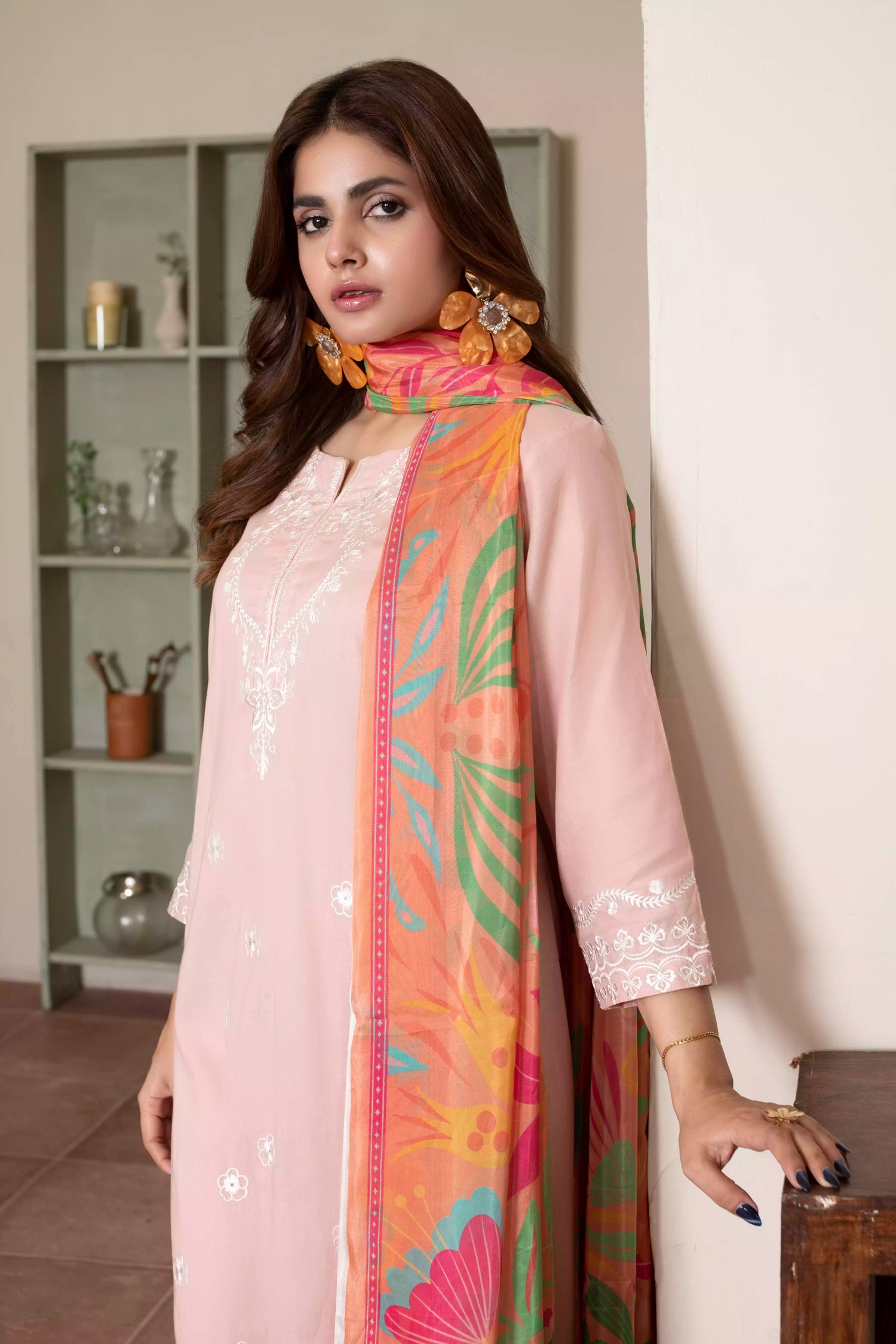 Soft pink embroidered suit with white floral motifs, matching trousers, and a vibrant multicolor silk dupatta for summer elegance.