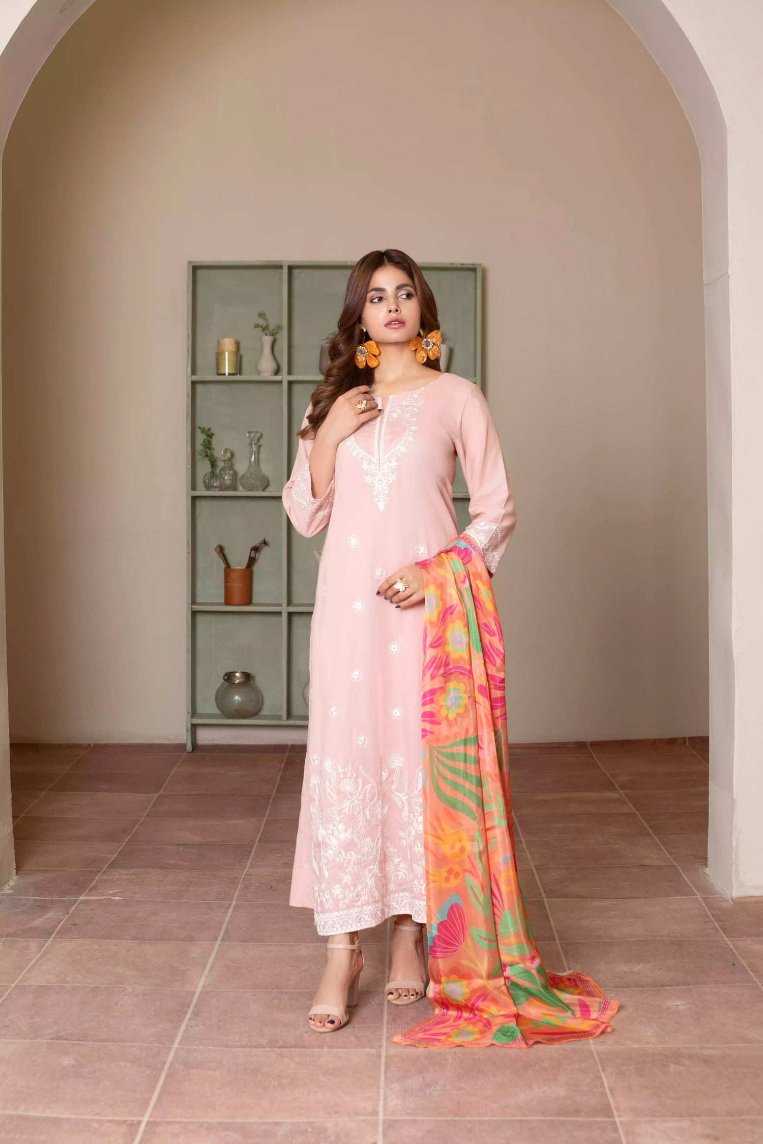 Soft pink embroidered suit with white floral motifs, matching trousers, and a vibrant multicolor silk dupatta for summer elegance.