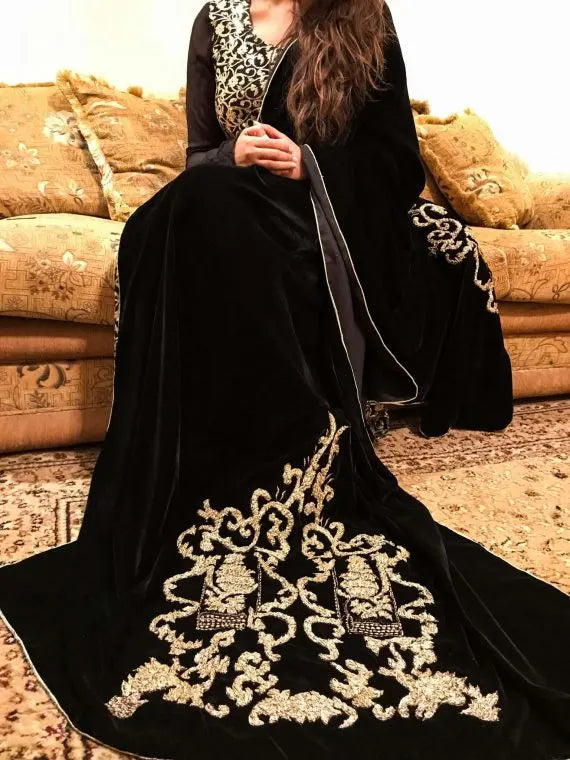 A stunning velvet shawl highlighting the exquisite Gota Embroidered work motif. Its intricate design work makes it ideal for weddings and festive wear.