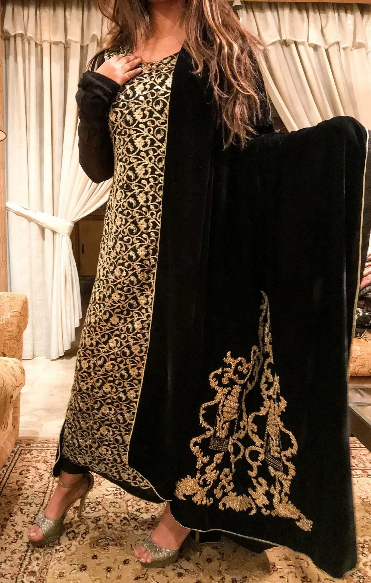 A stunning velvet shawl highlighting the exquisite Gota Embroidered work motif. Its intricate design work makes it ideal for weddings and festive wear.