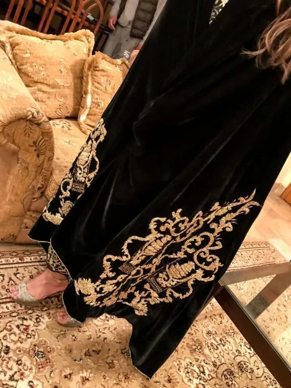 A stunning velvet shawl highlighting the exquisite Gota Embroidered work motif. Its intricate design work makes it ideal for weddings and festive wear.