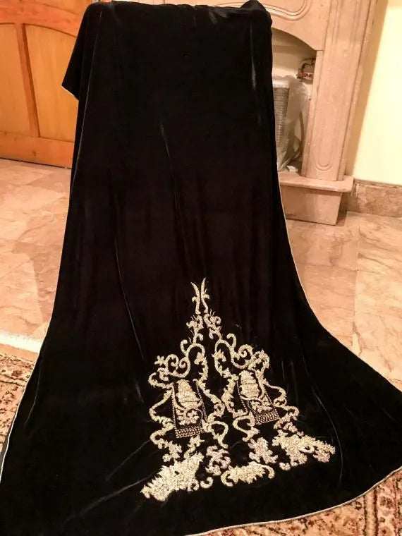A stunning velvet shawl highlighting the exquisite Gota Embroidered work motif. Its intricate design work makes it ideal for weddings and festive wear.