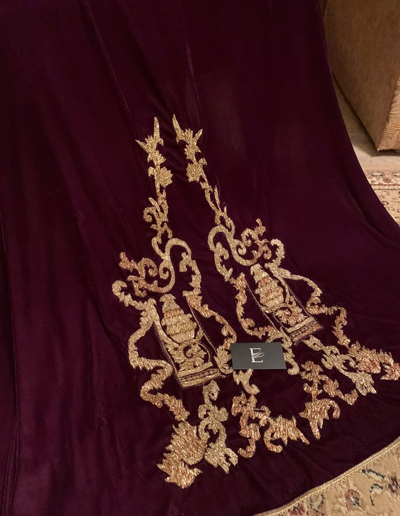 A stunning velvet shawl highlighting the exquisite Gota Embroidered work motif. Its intricate design work makes it ideal for weddings and festive wear.