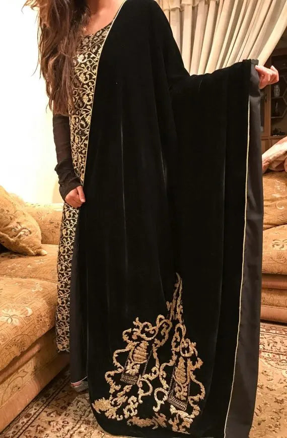 A stunning velvet shawl highlighting the exquisite Gota Embroidered work motif. Its intricate design work makes it ideal for weddings and festive wear.