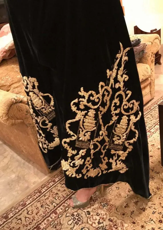 A stunning velvet shawl highlighting the exquisite Gota Embroidered work motif. Its intricate design work makes it ideal for weddings and festive wear.