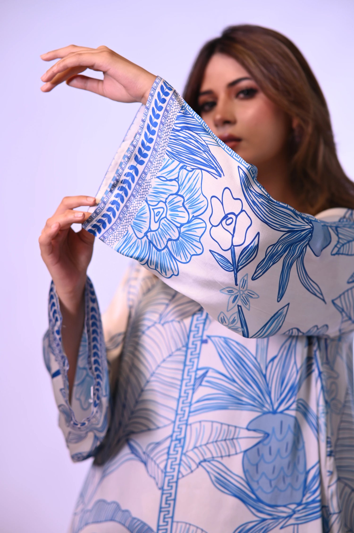 Blue and white silk cord set with a hand-drawn print, featuring a relaxed fit for effortless chic style and comfort.