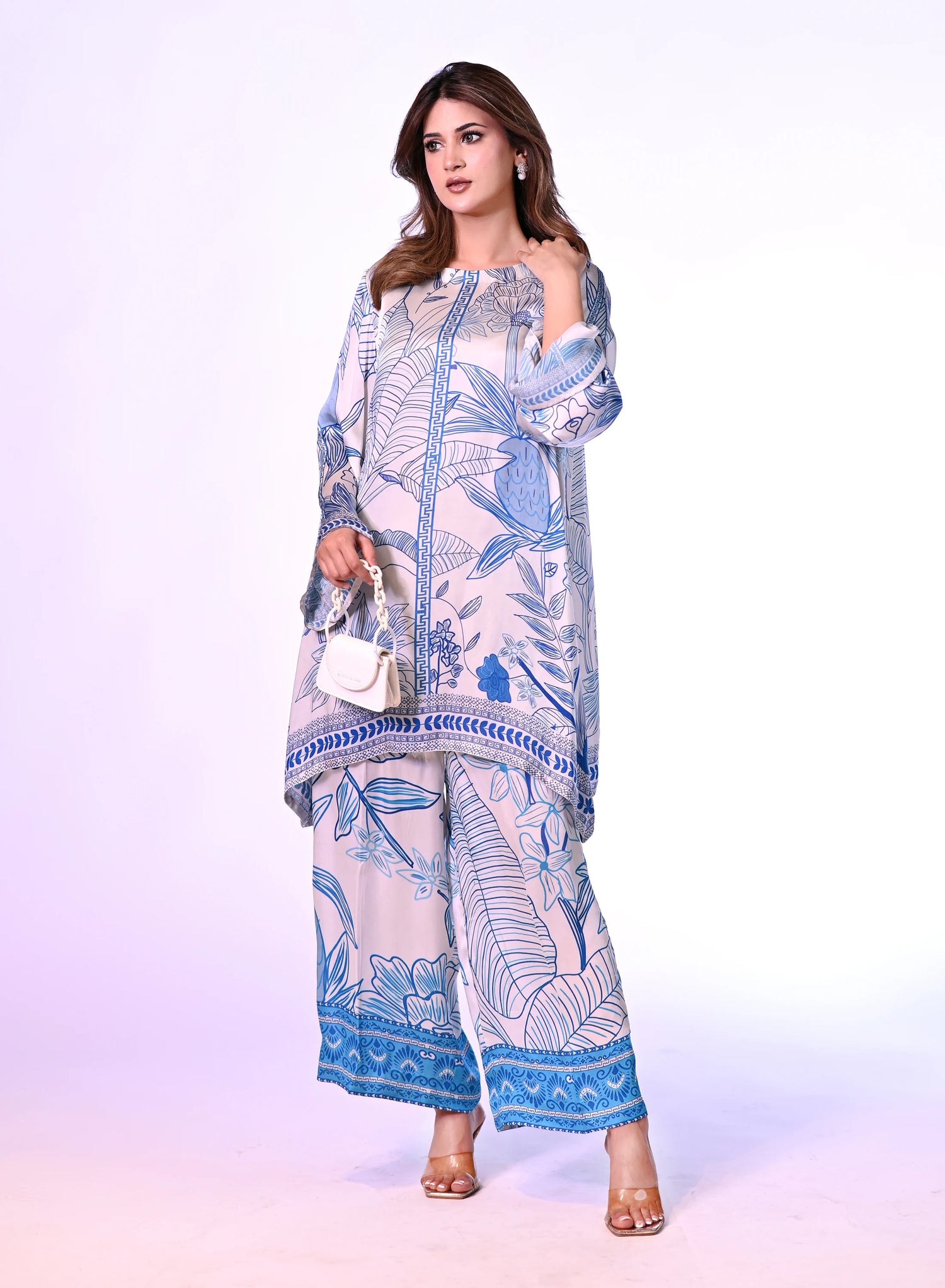 Blue and white silk cord set with a hand-drawn print, featuring a relaxed fit for effortless chic style and comfort.