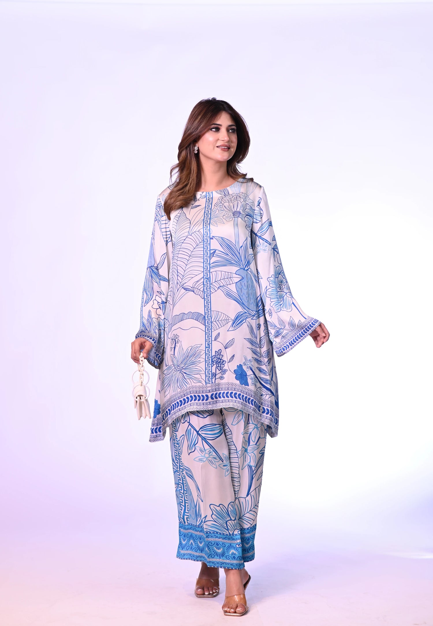 Blue and white silk cord set with a hand-drawn print, featuring a relaxed fit for effortless chic style and comfort.