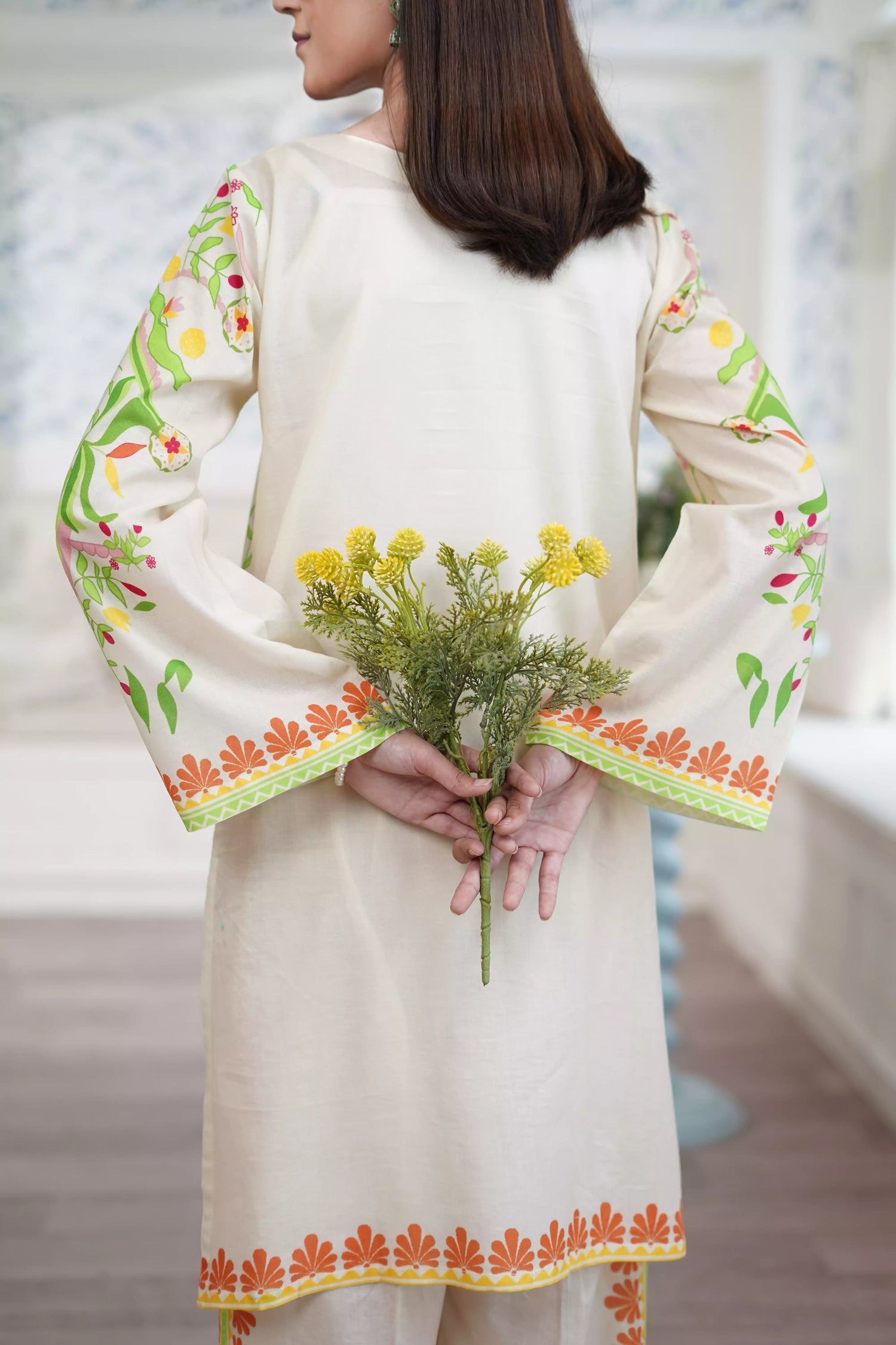 Wrap yourself in summer charm with Buttercream Belle in warm shades of orange, yellow, green, and off-white blended with modern elegance.