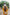 Yellow floral two-piece suit with long shirt and flared pants, styled for casual and semi-formal occasions.