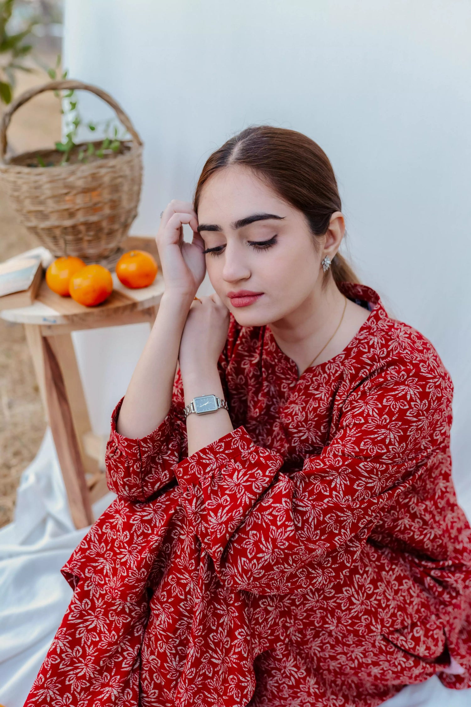 Chic maroon ensemble with bold floral design and puff sleeves, paired with loose-fit shalwar.
