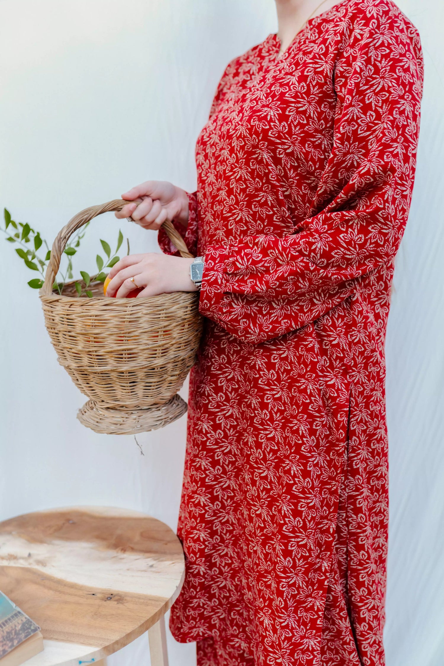 Chic maroon ensemble with bold floral design and puff sleeves, paired with loose-fit shalwar.
