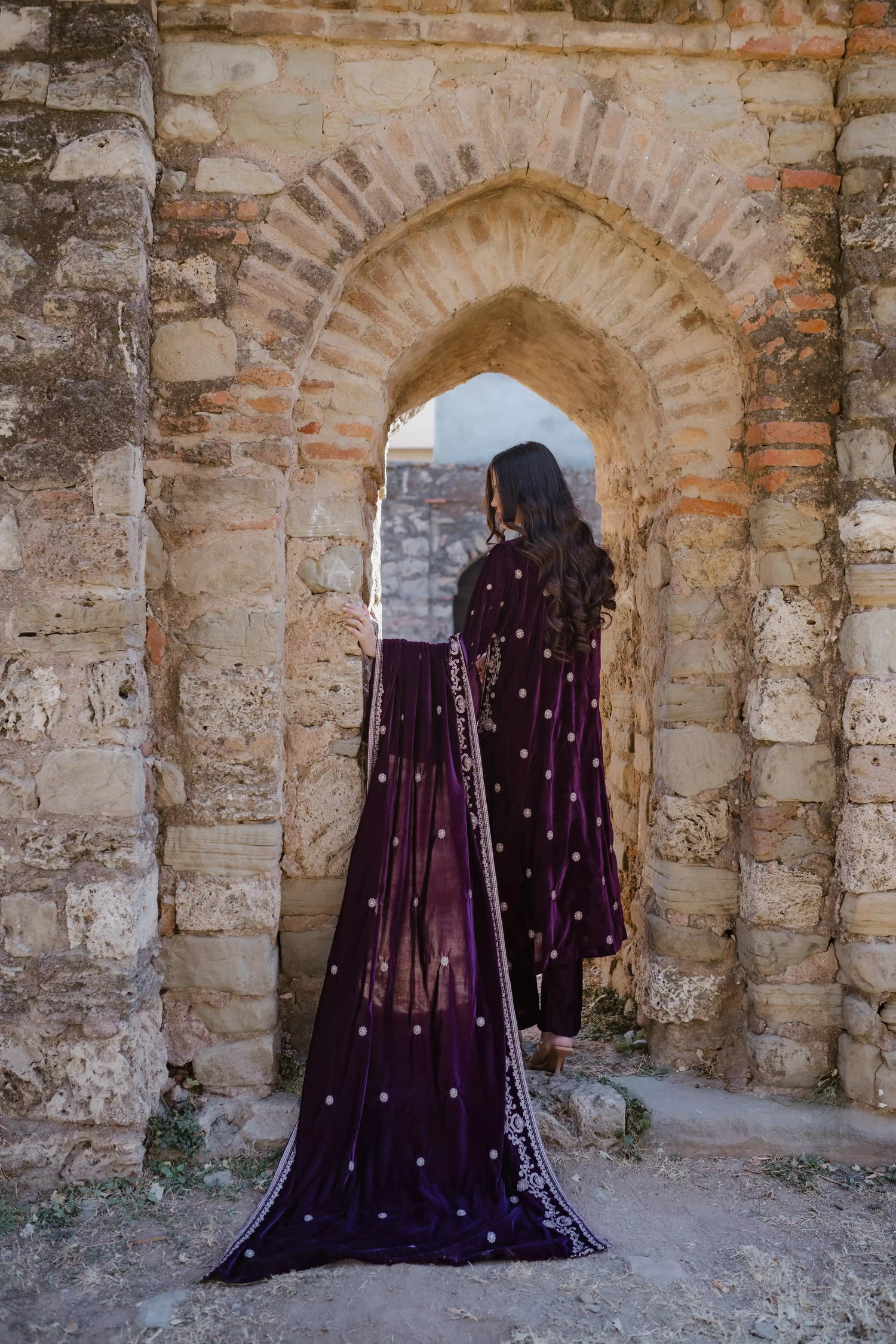 Exquisite velvet suit with intricate shirt embroidery, a detailed velvet shawl, and plain pants for a refined, elegant contrast.