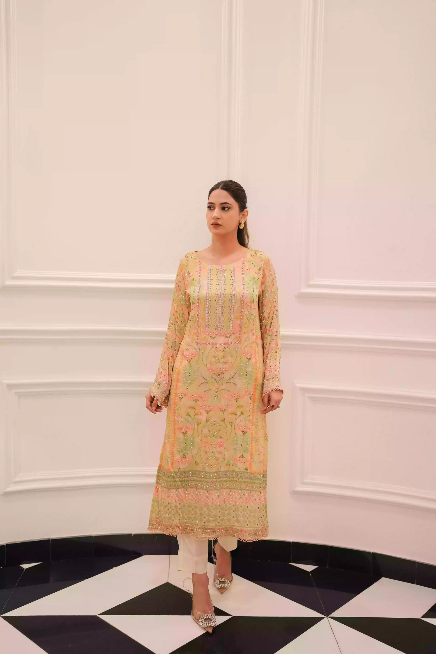 Lime yellow silk kurta in a soft pastel tone, featuring intricate floral embellishment on full-length sleeves, and a relaxed elegant silhouette, designed for festive eid gatherings, daytime celebrations, and refined evening wear.