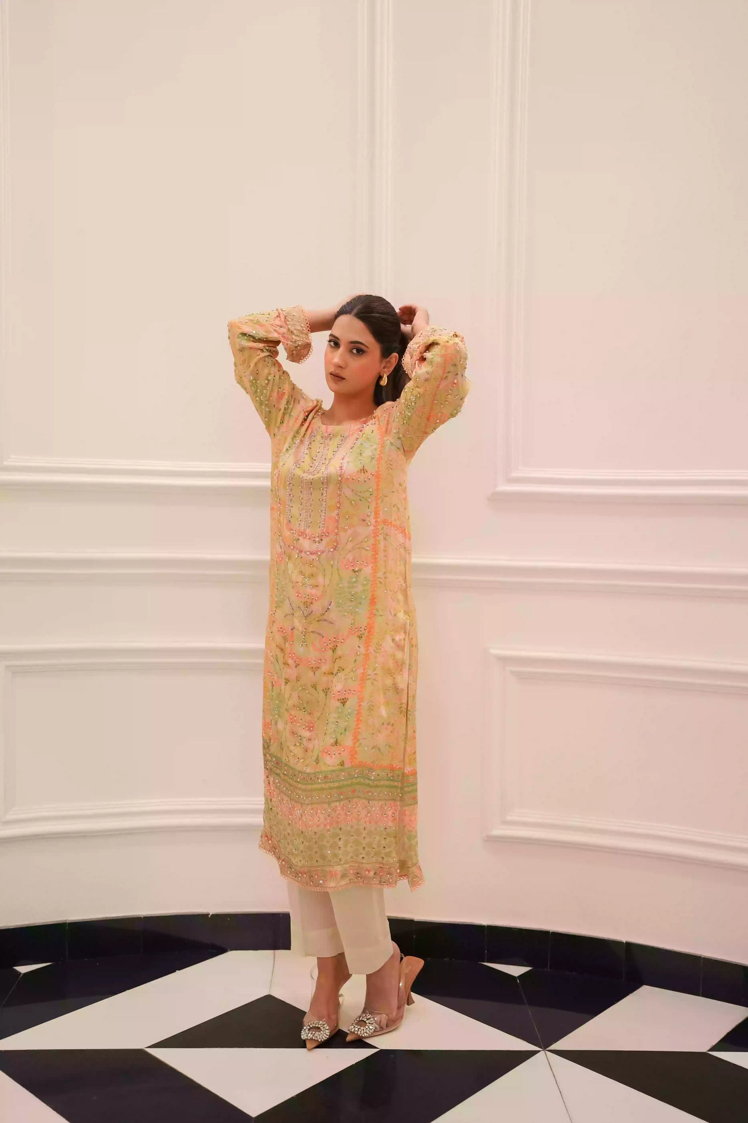 Lime yellow silk kurta in a soft pastel tone, featuring intricate floral embellishment on full-length sleeves, and a relaxed elegant silhouette, designed for festive eid gatherings, daytime celebrations, and refined evening wear.