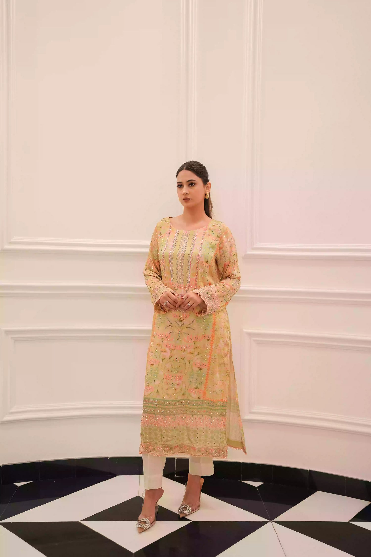 Lime yellow silk kurta in a soft pastel tone, featuring intricate floral embellishment on full-length sleeves, and a relaxed elegant silhouette, designed for festive eid gatherings, daytime celebrations, and refined evening wear.