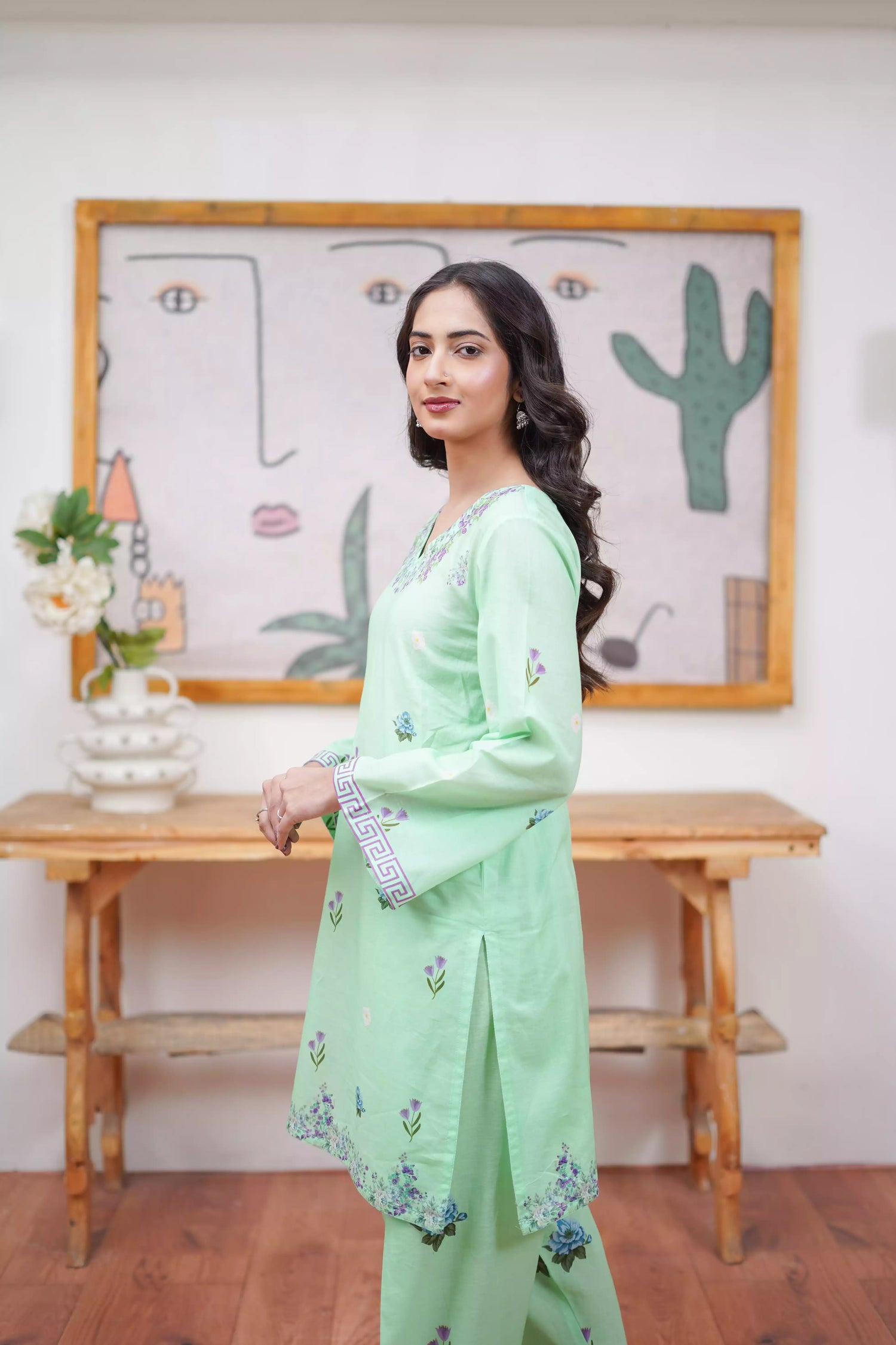 Mint green 2-piece suit with a breezy silhouette and delicate floral patterns, featuring a flattering cut and soft pastel tone, ideal for casual and semi-formal wear.