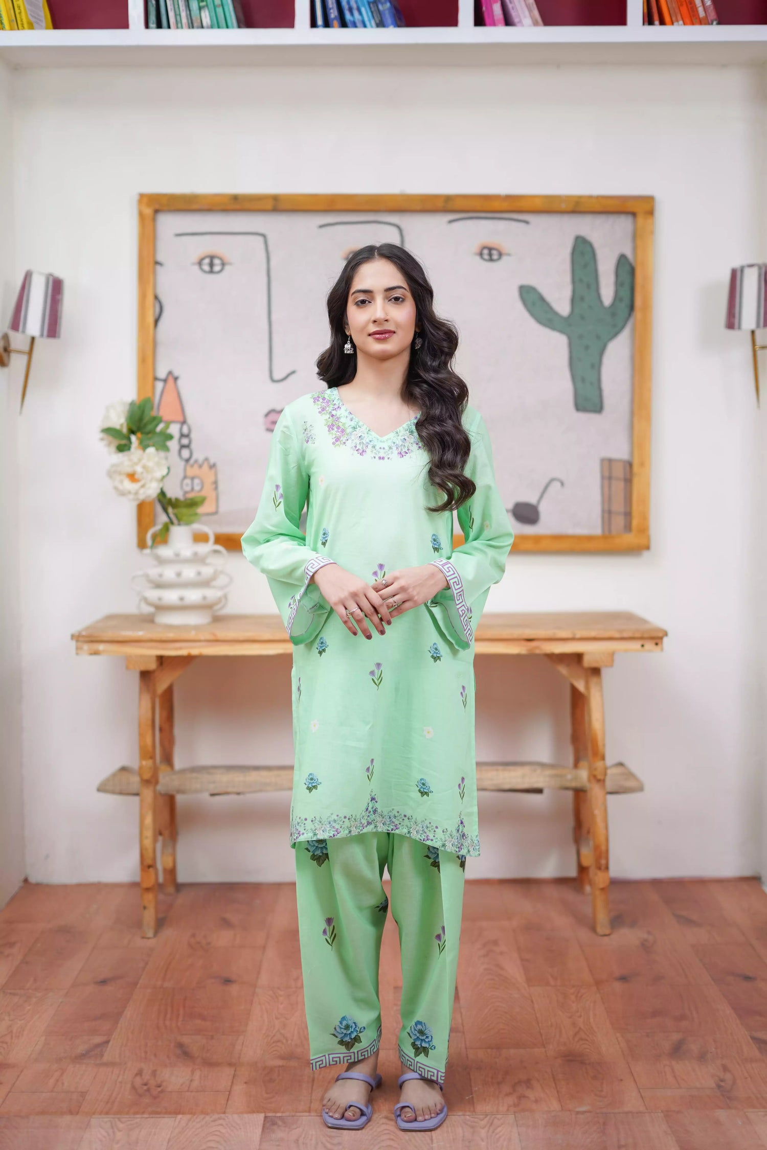 Mint green 2-piece suit with a breezy silhouette and delicate floral patterns, featuring a flattering cut and soft pastel tone, ideal for casual and semi-formal wear.