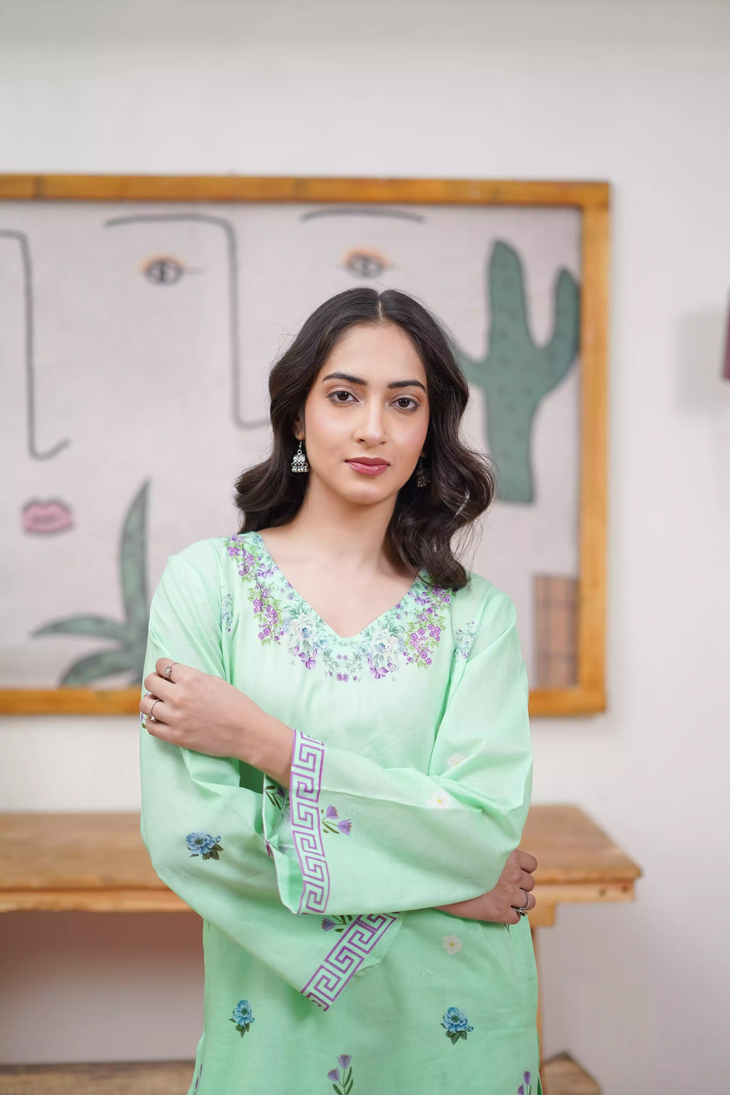 Mint green 2-piece suit with a breezy silhouette and delicate floral patterns, featuring a flattering cut and soft pastel tone, ideal for casual and semi-formal wear.