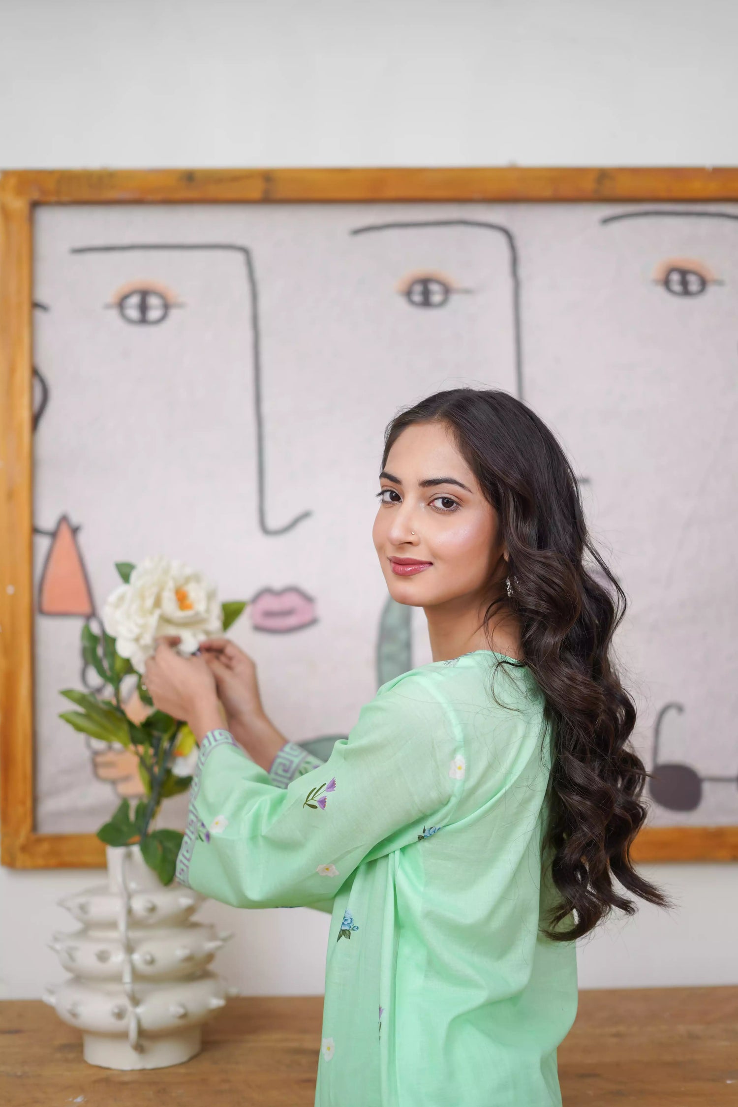 Mint green 2-piece suit with a breezy silhouette and delicate floral patterns, featuring a flattering cut and soft pastel tone, ideal for casual and semi-formal wear.