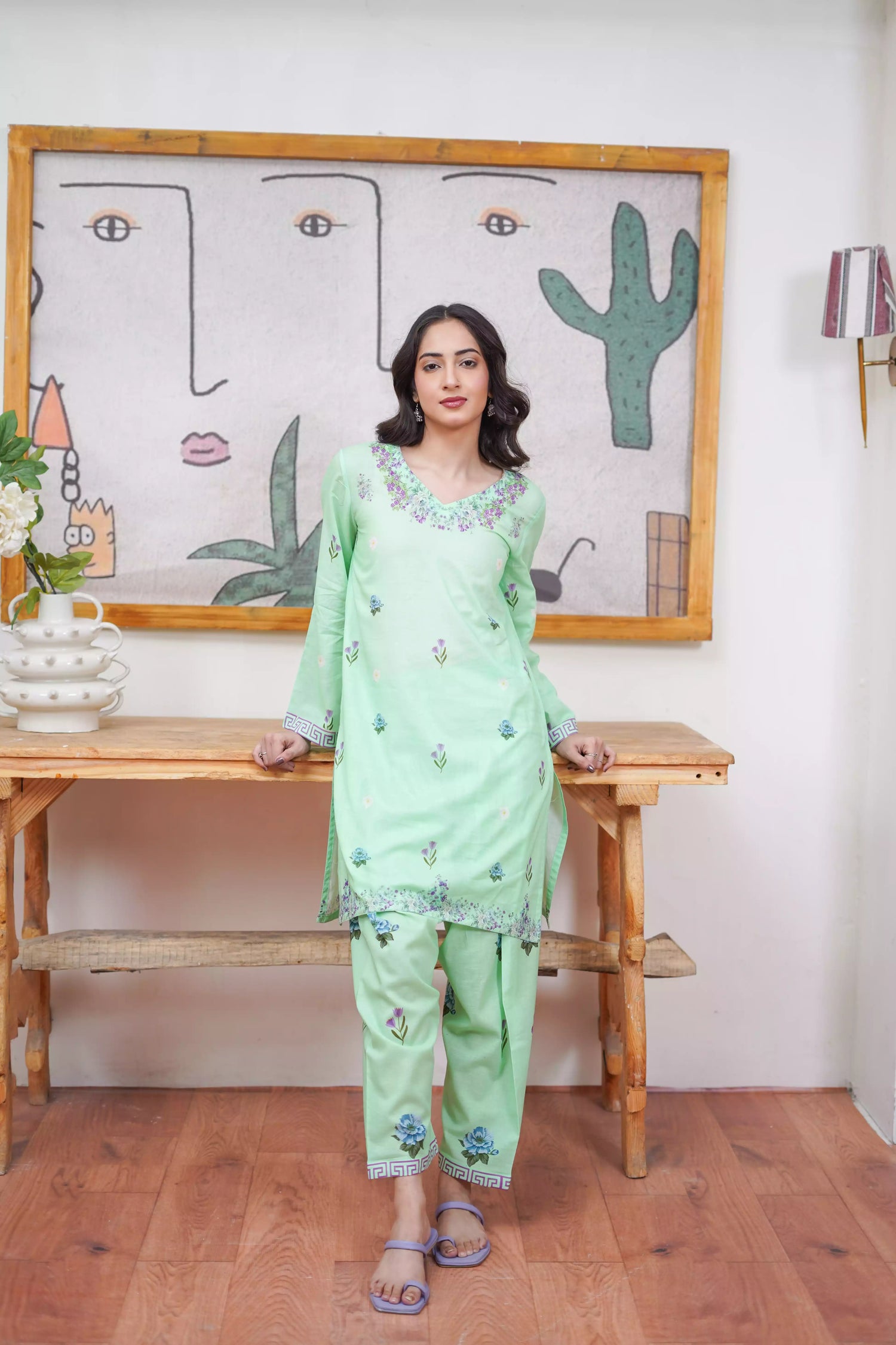 Mint green 2-piece suit with a breezy silhouette and delicate floral patterns, featuring a flattering cut and soft pastel tone, ideal for casual and semi-formal wear.